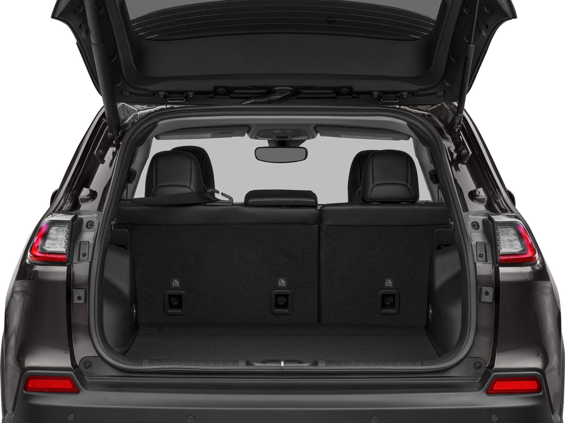 Open rear trunk with black interior and visible back seats.