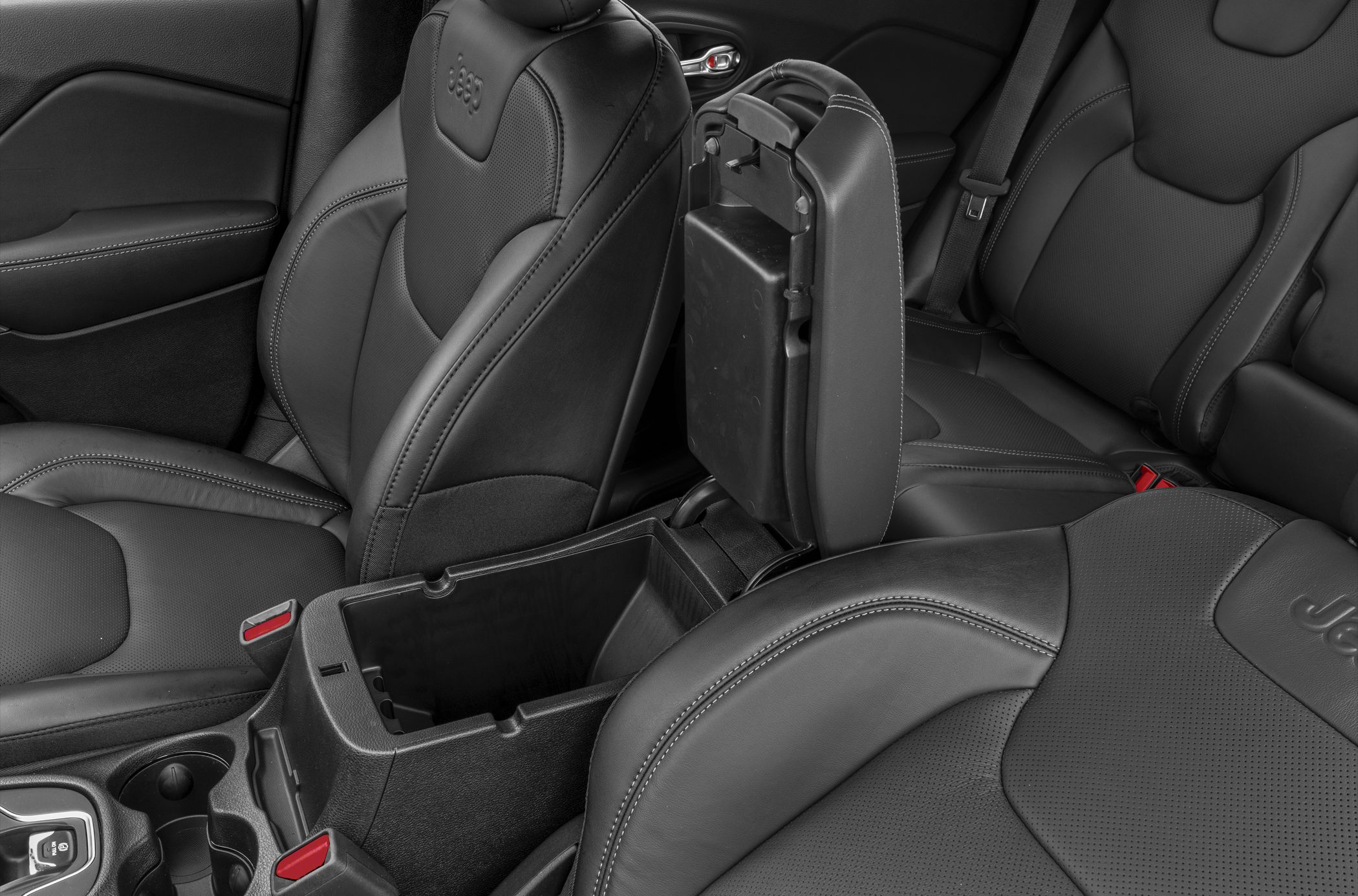 Black leather seats with open center console storage