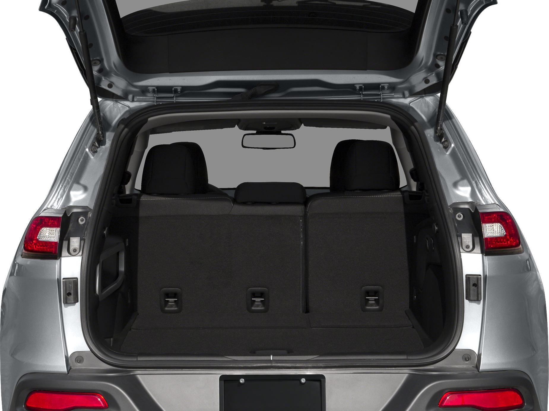 Rear cargo space with open tailgate and rear seats of an SUV