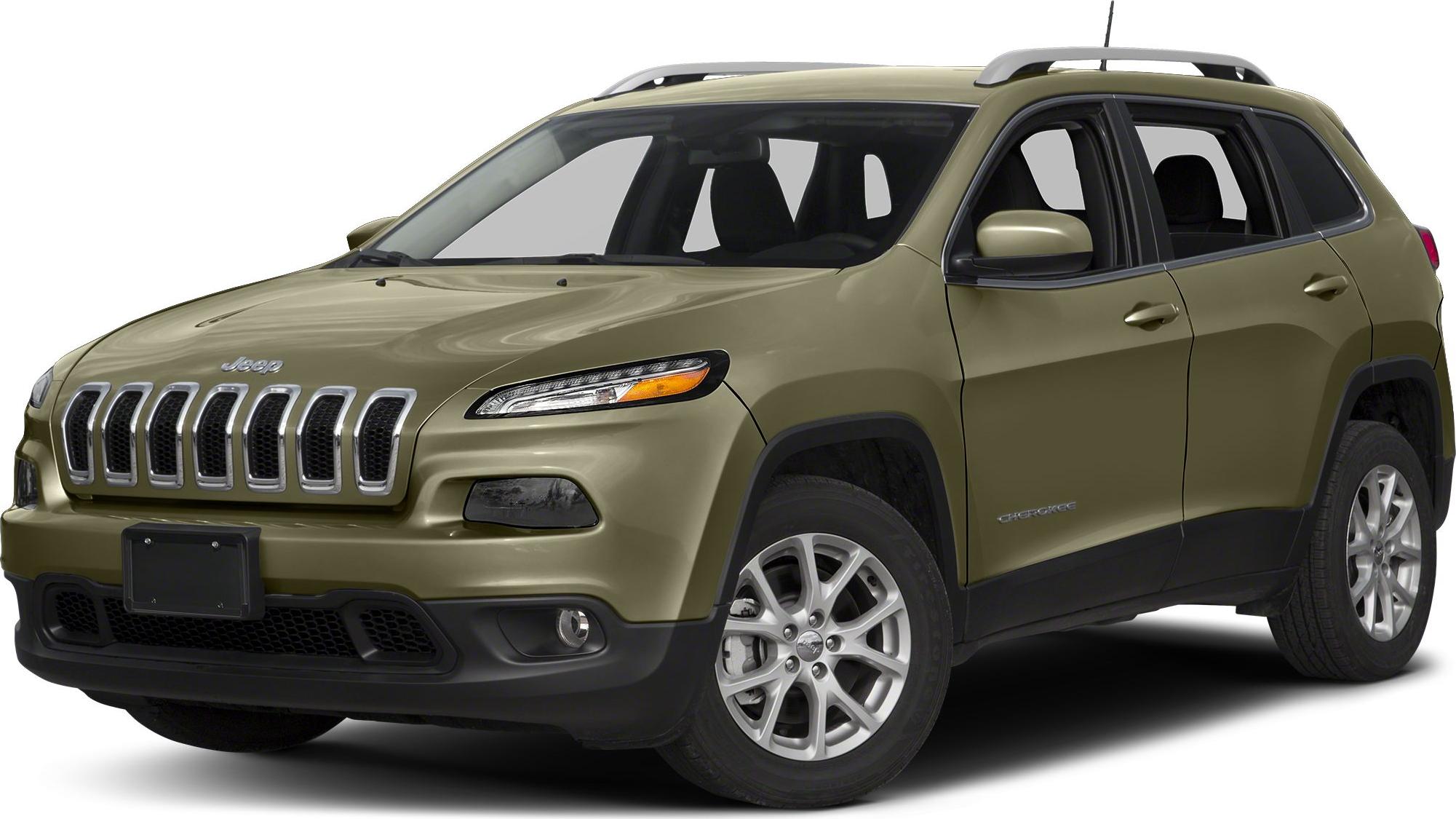 Front side view of SUV with distinctive grille and roof rails