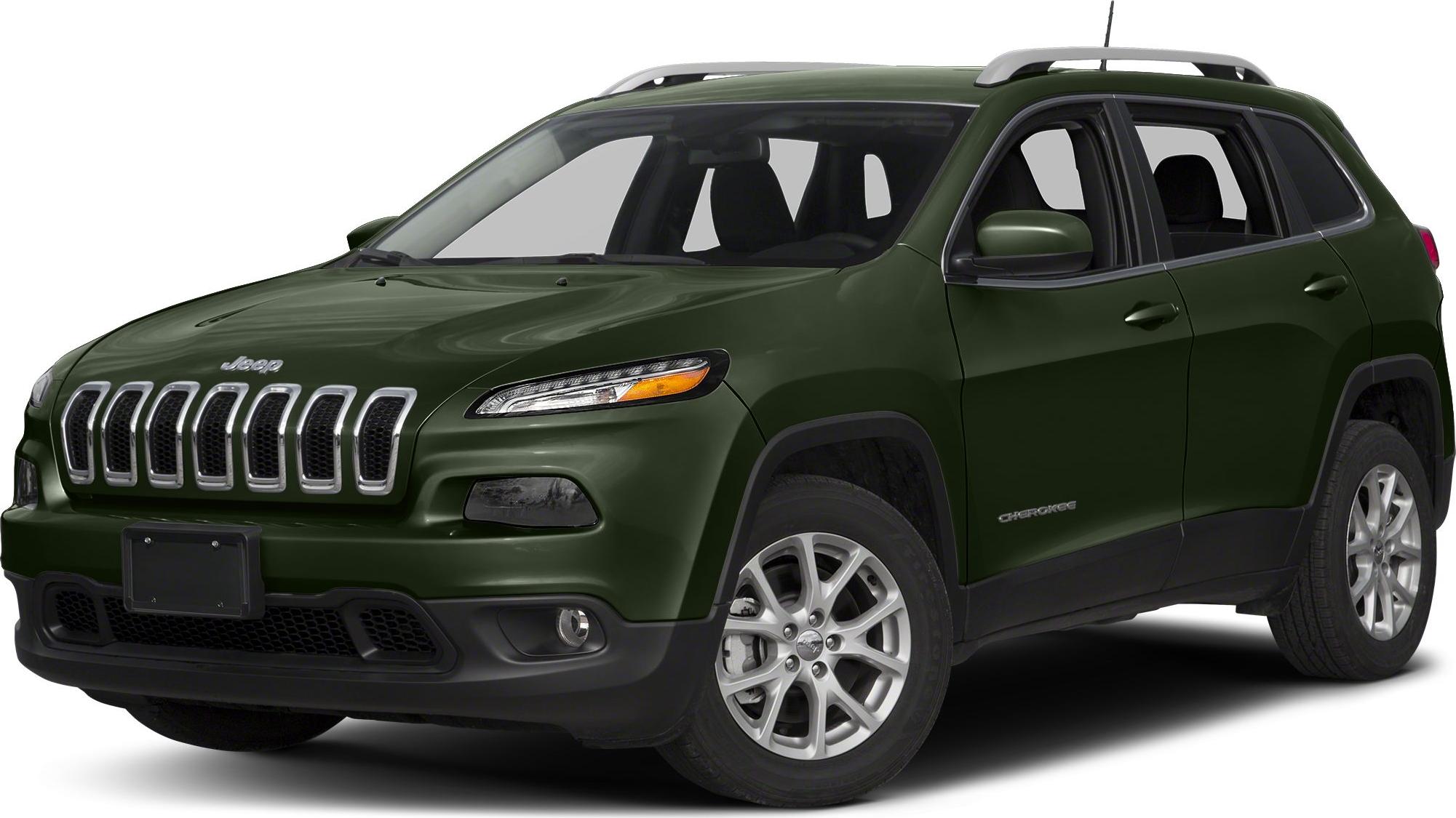 Front three-quarter view of green SUV with distinctive grille and roof rails