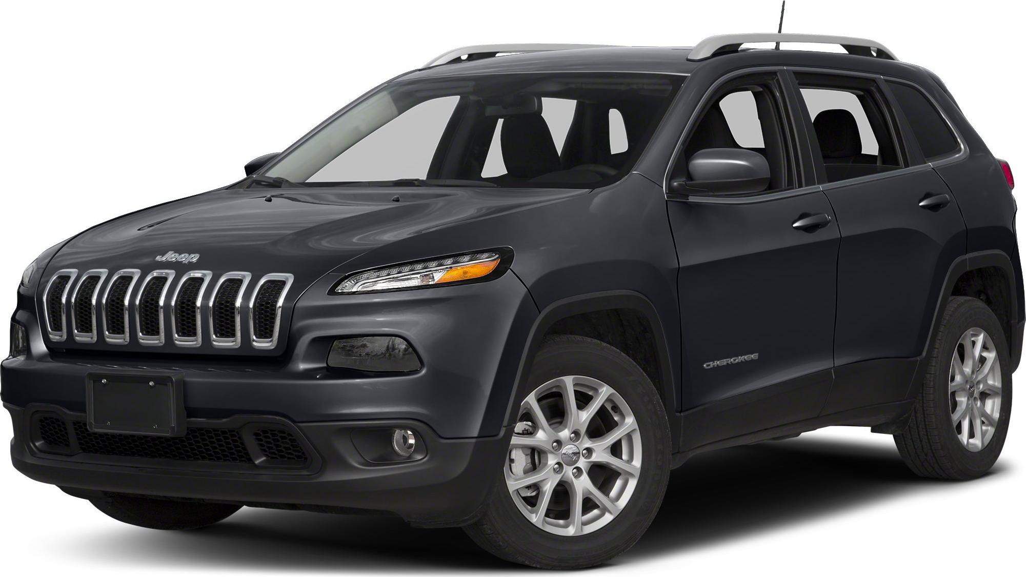 Front side view of an SUV with seven-slot grille and sleek headlights