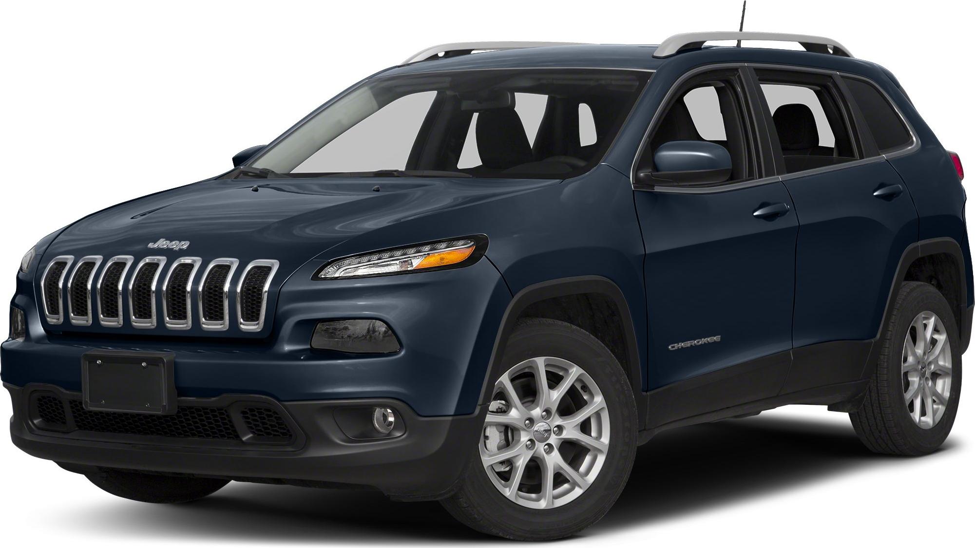 Seven-slot grille with chrome roof rails on mid-size SUV front-side.