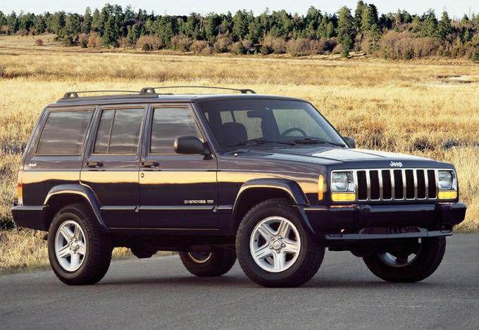 Rugged SUV front-side view with distinctive grille and large tires