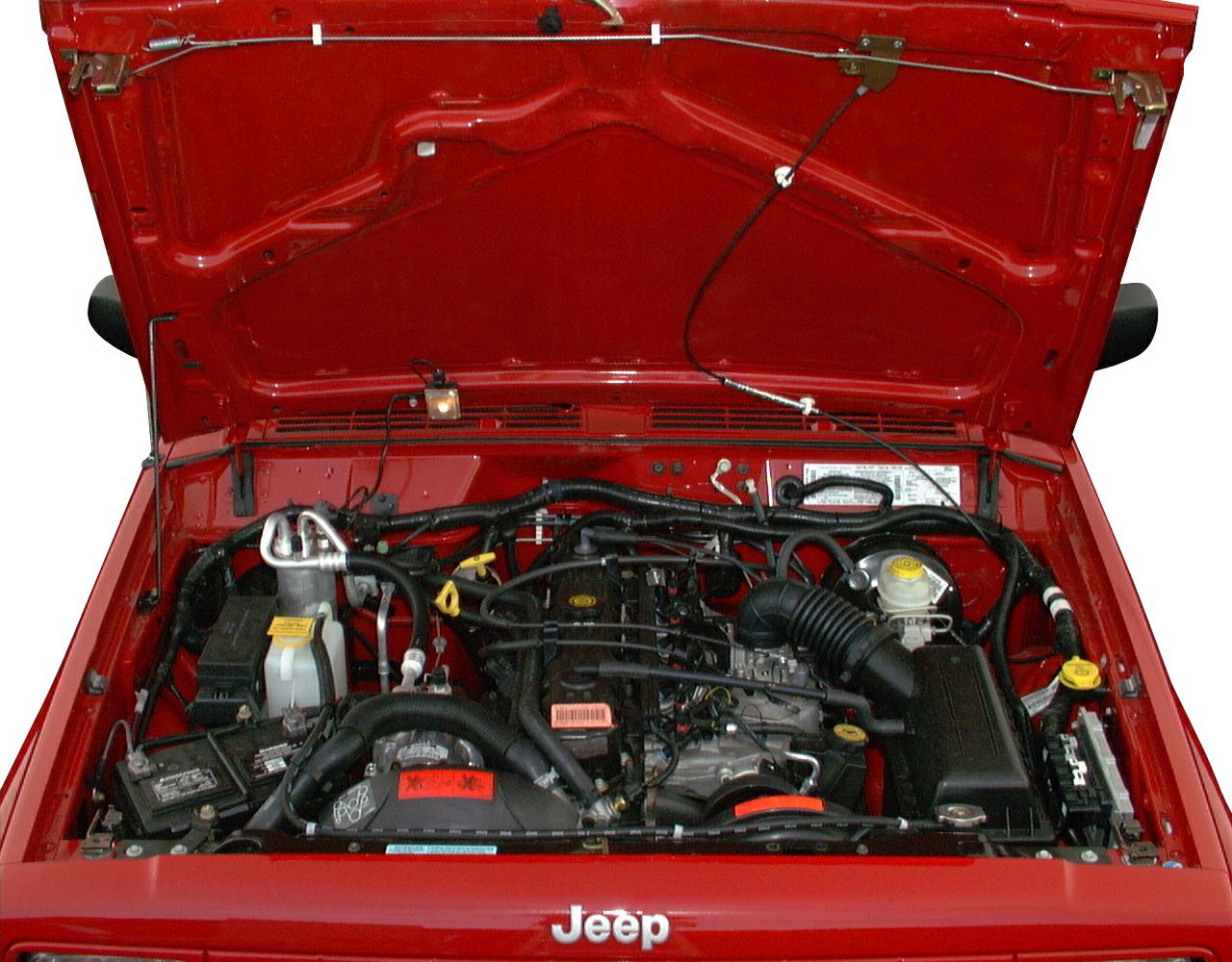 Open engine bay with visible mechanical and electrical components under hood