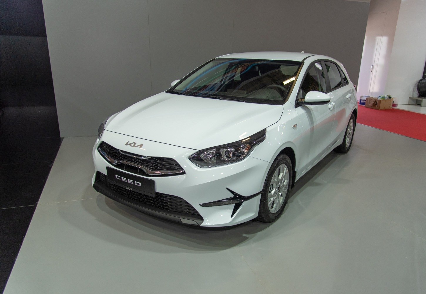 Front and side view of a compact hatchback with modern design and distinctive headlights