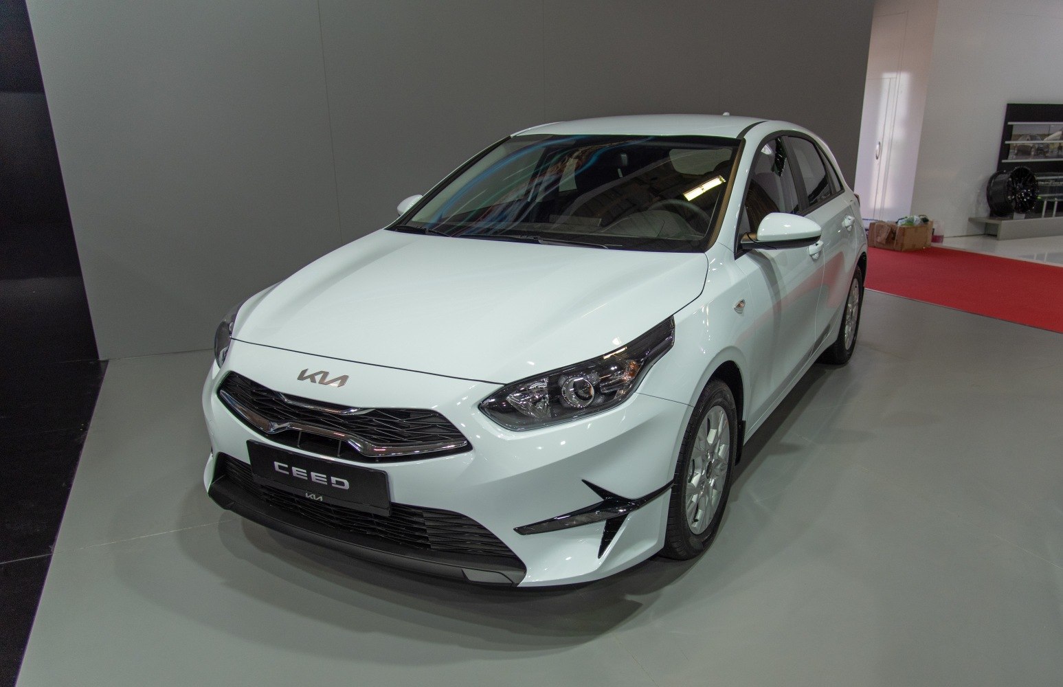 Front view of compact hatchback with LED headlights and aerodynamic grille