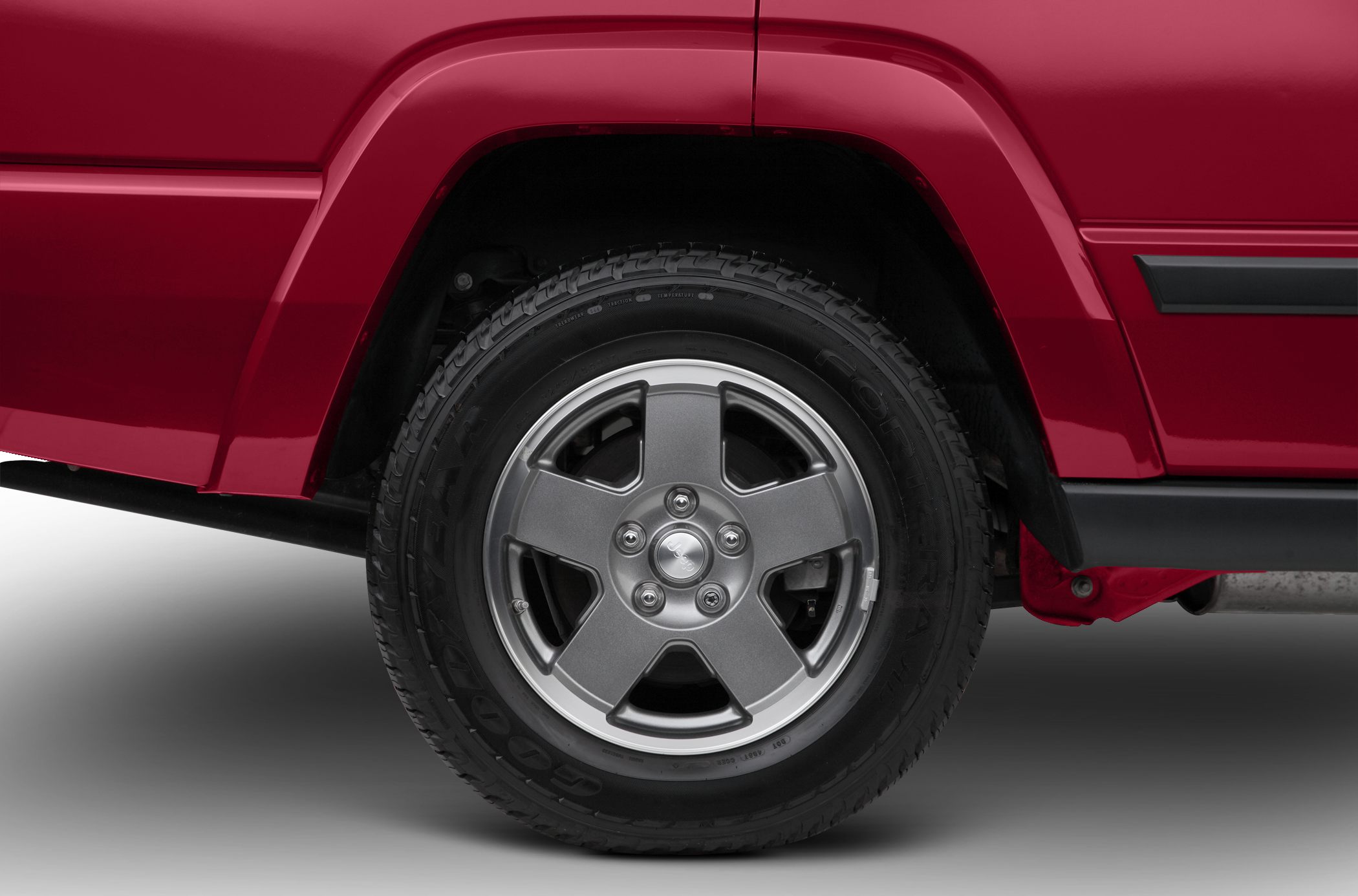 Front wheel and fender close-up with alloy rim and tire tread