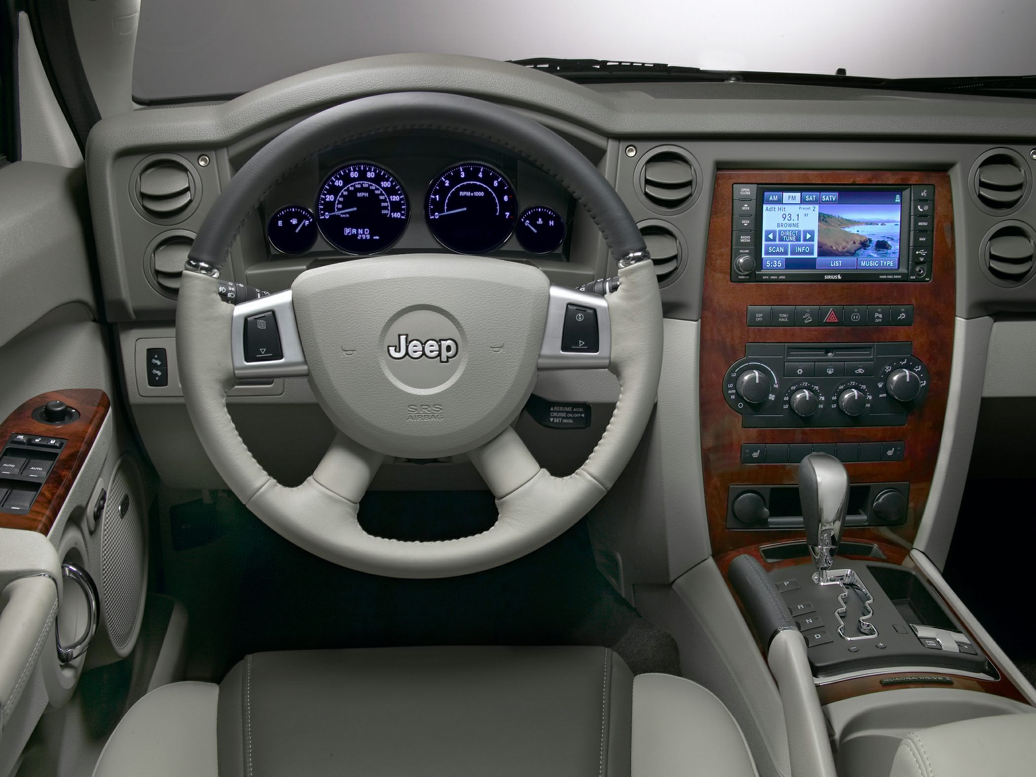 Dashboard, steering wheel, and center console with controls and display