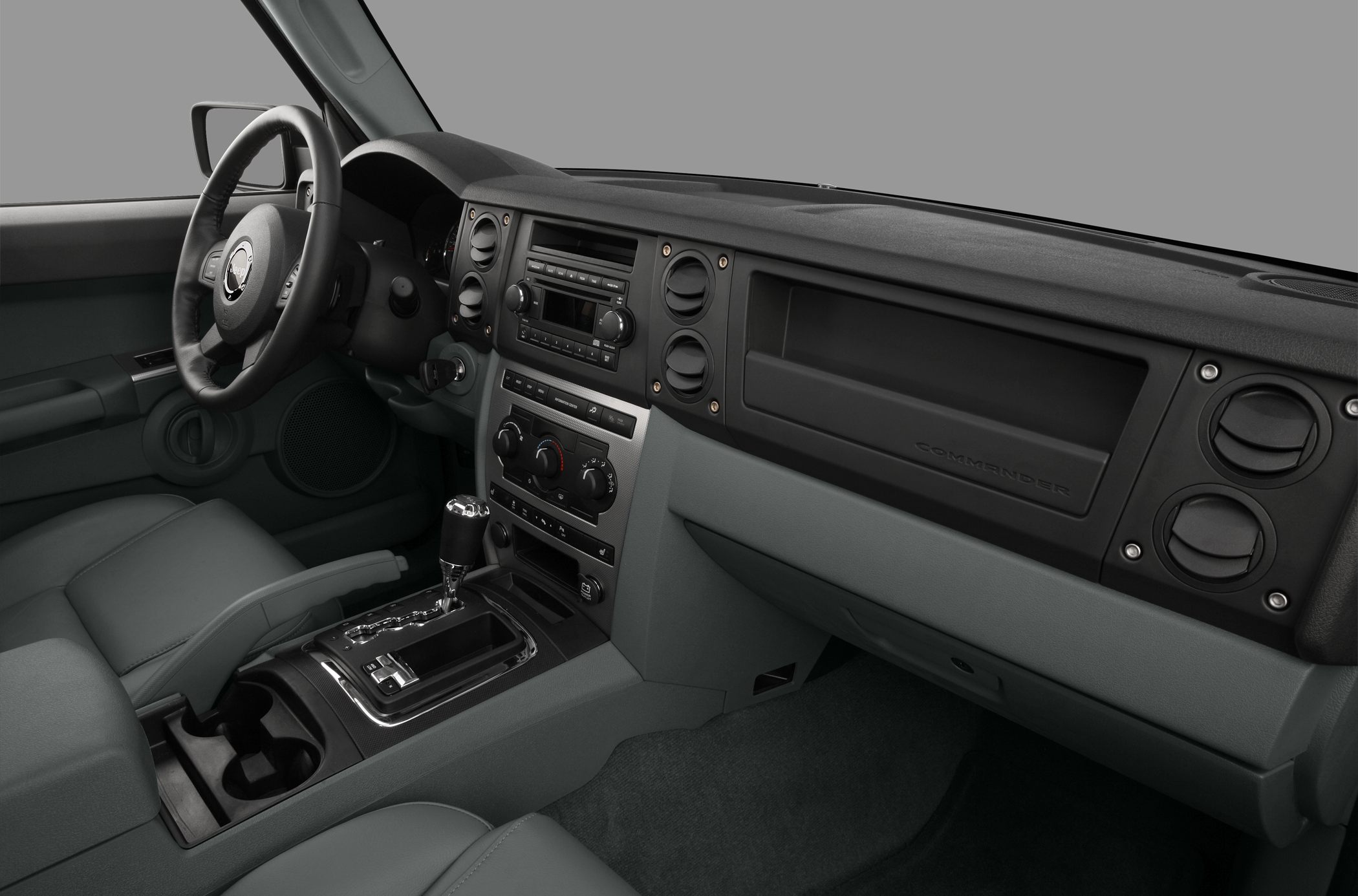 Interior dashboard and center console with gear shift and multiple air vents