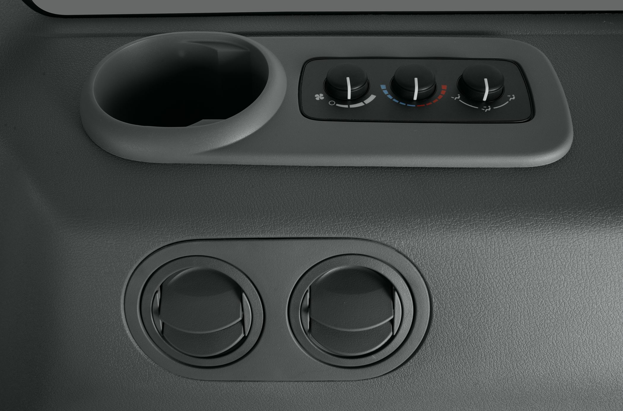 Manual climate control knobs and dual air vents in vehicle interior
