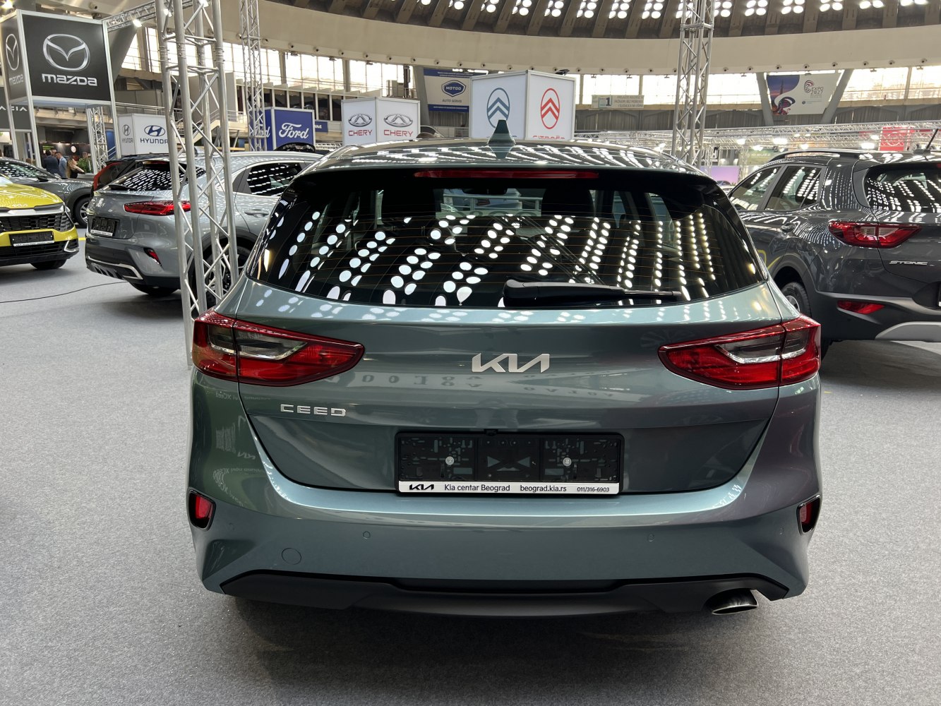 Rear view of hatchback with distinctive taillights and rear window wiper