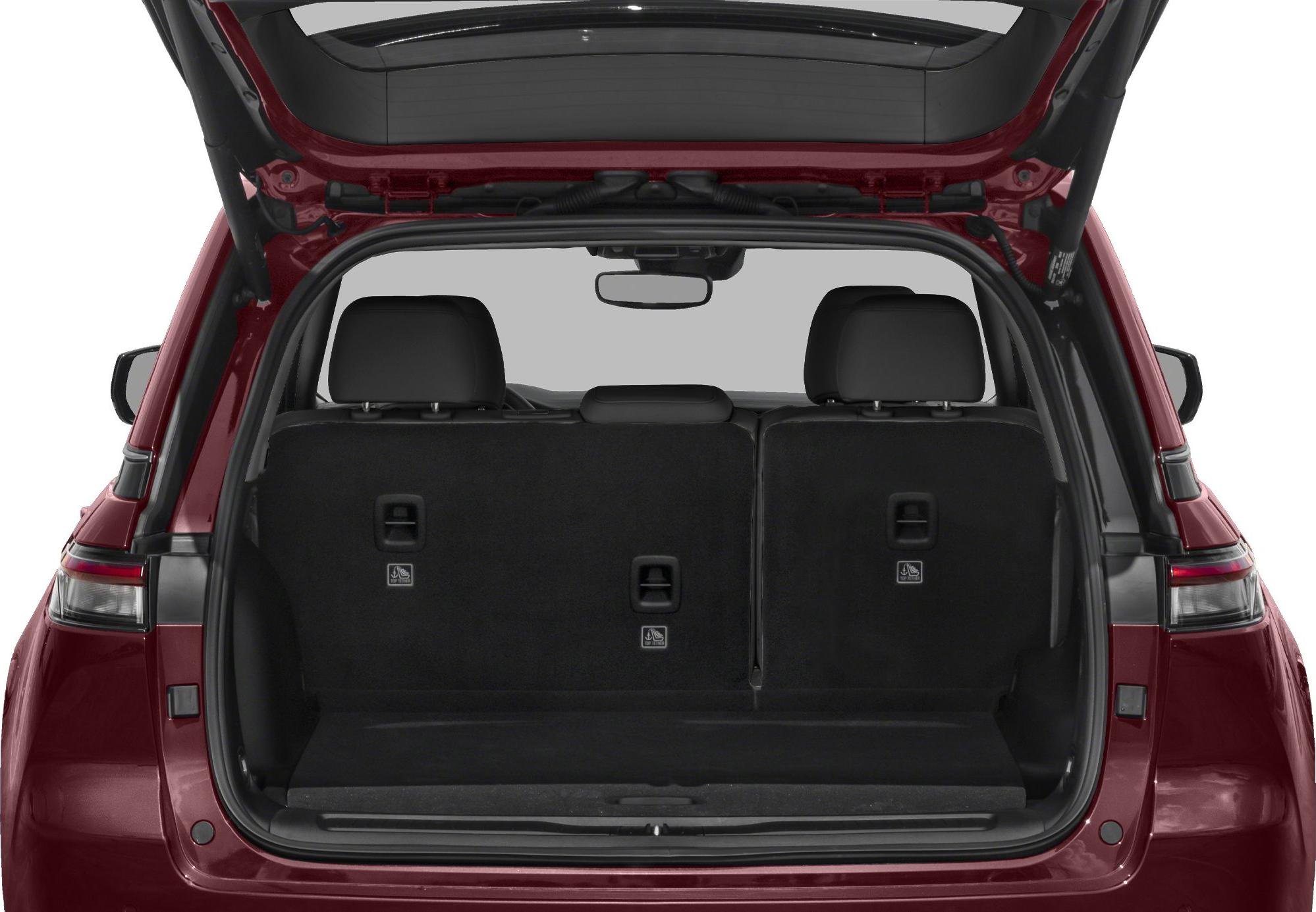 Rear hatch open showing cargo area and upright back seats