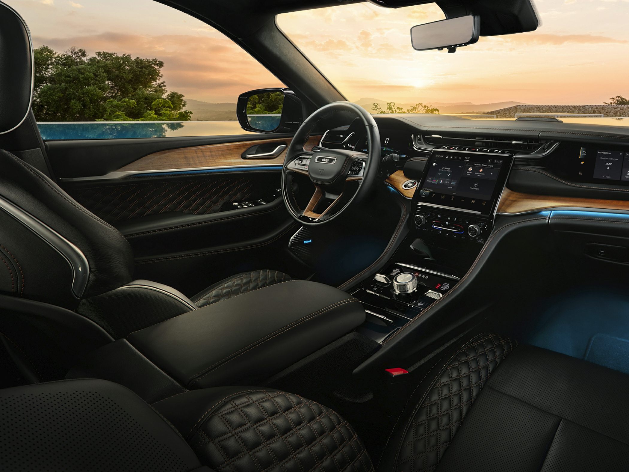 Luxury interior with wood trim, touchscreen, and quilted leather seats