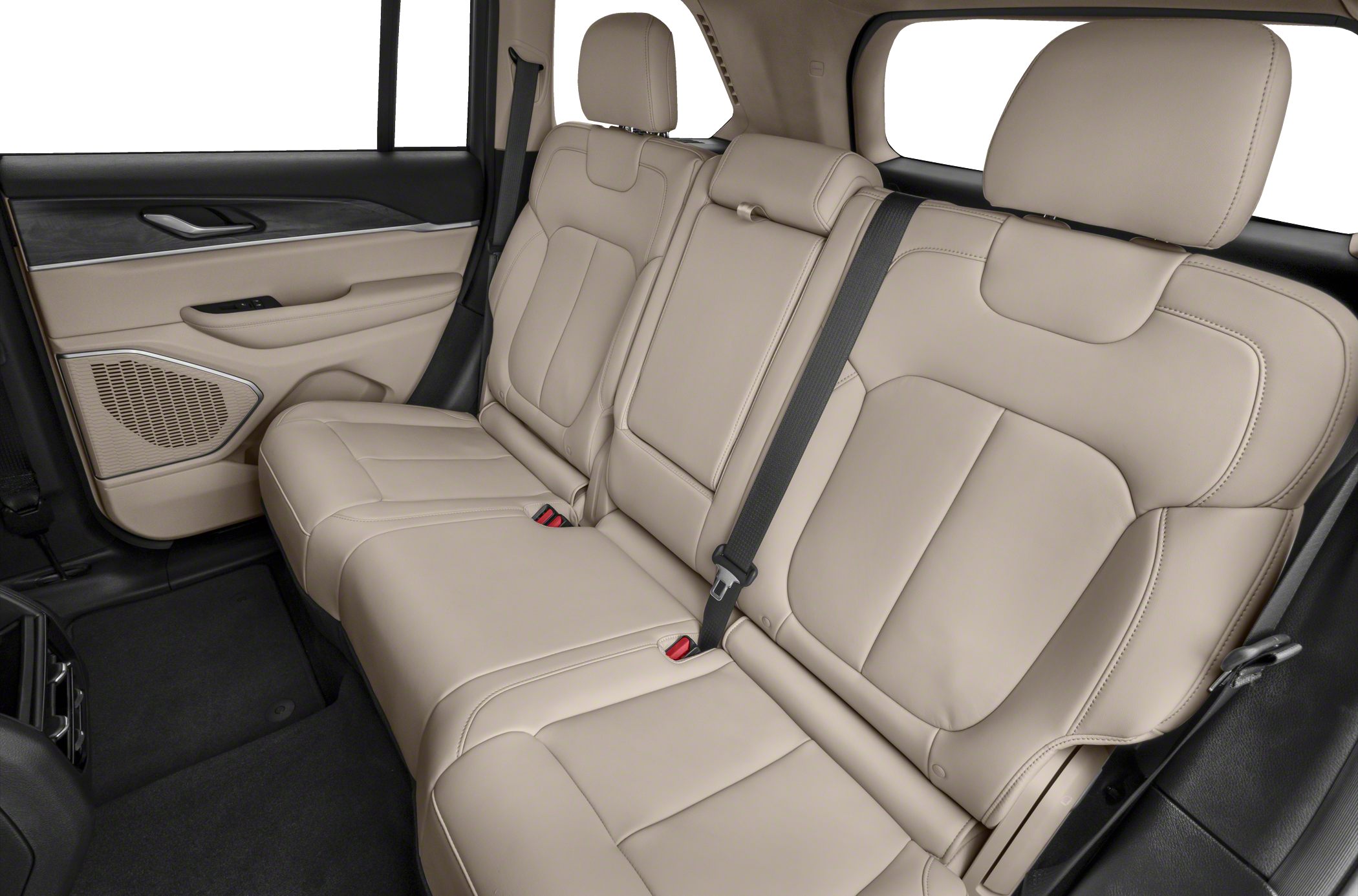 Beige leather rear seats with seat belts inside a vehicle