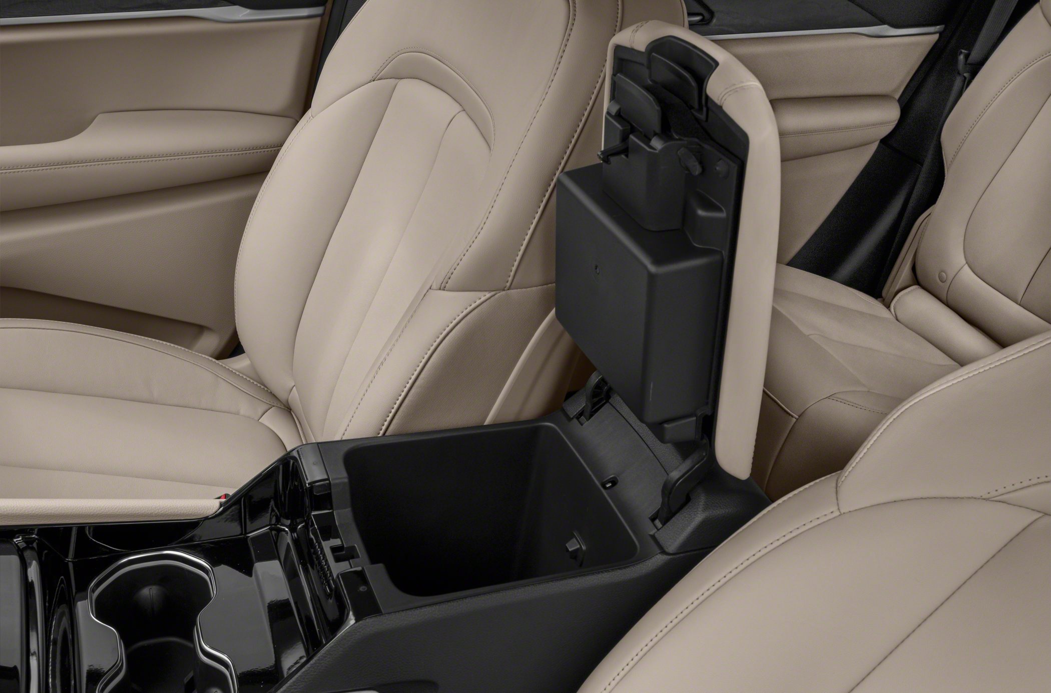 Center console storage compartment and beige leather seats