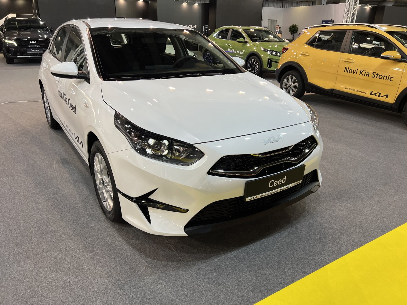 Front view with sleek headlights and distinctive grille design