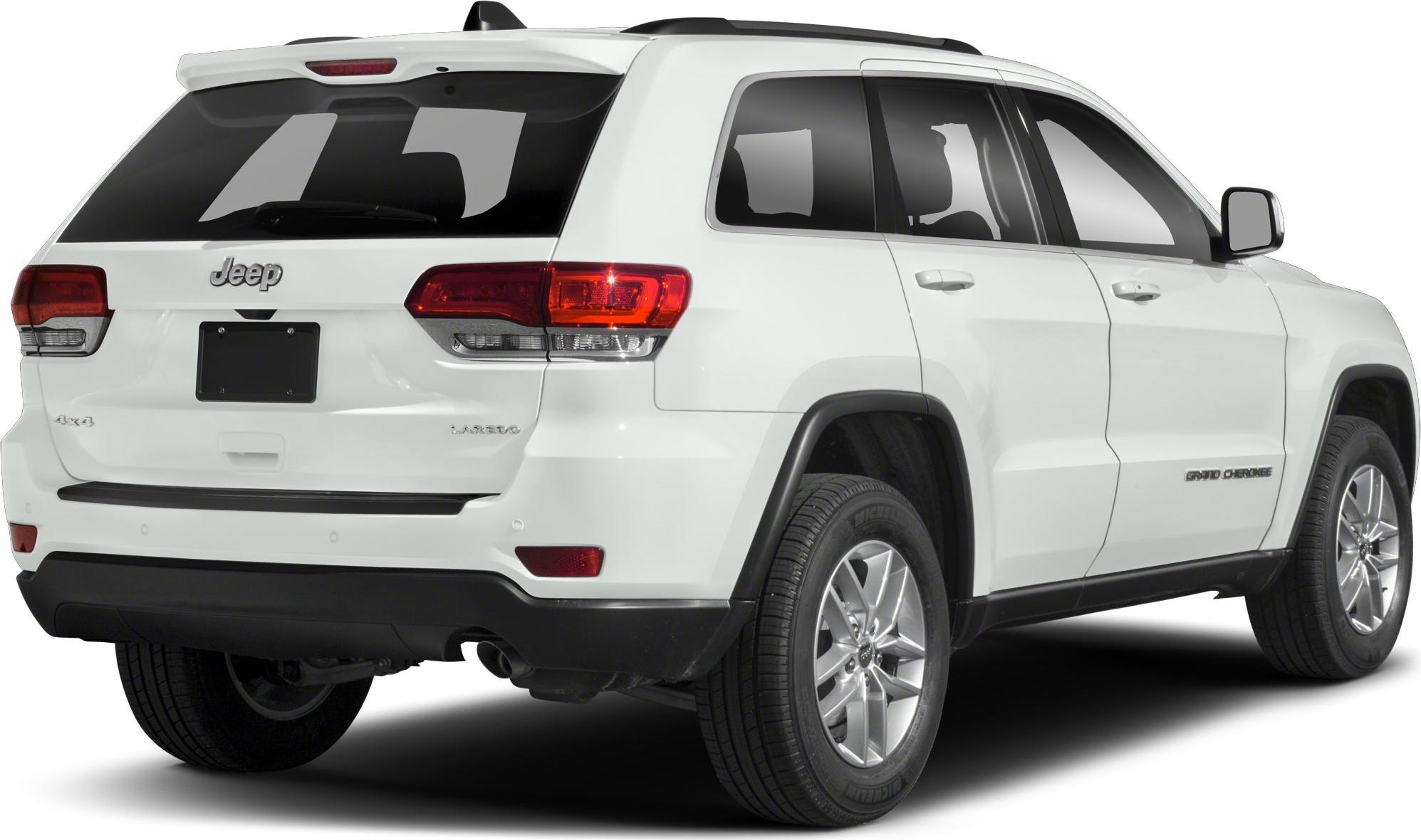 Rear side view of a white SUV with alloy wheels and distinctive taillights