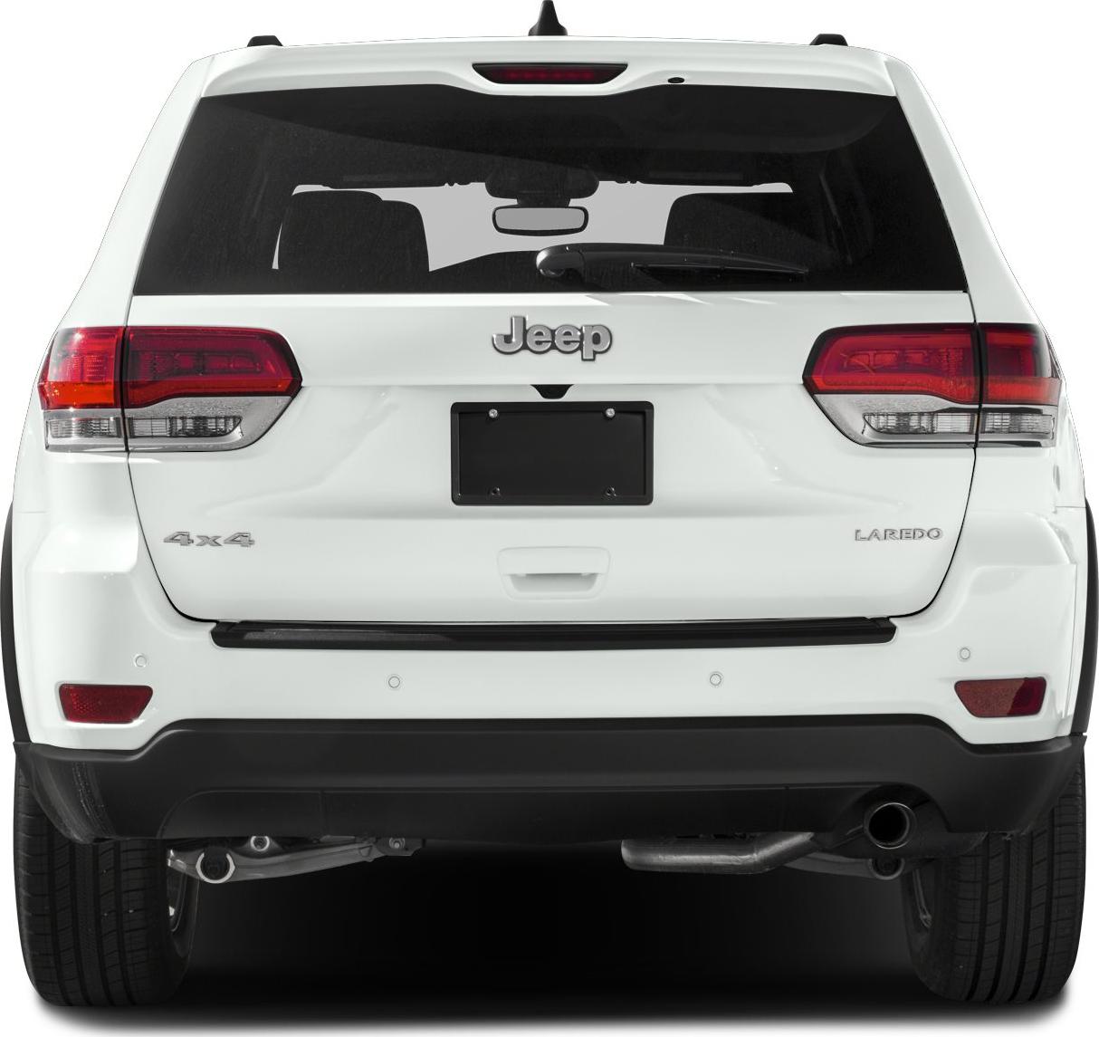 Rear view of white SUV featuring tail lights, license area, and rear badging