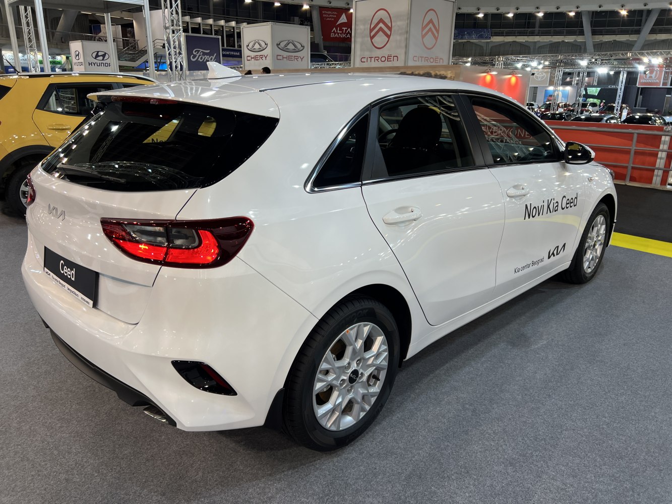 White hatchback rear and side profile with LED taillights and alloy wheels