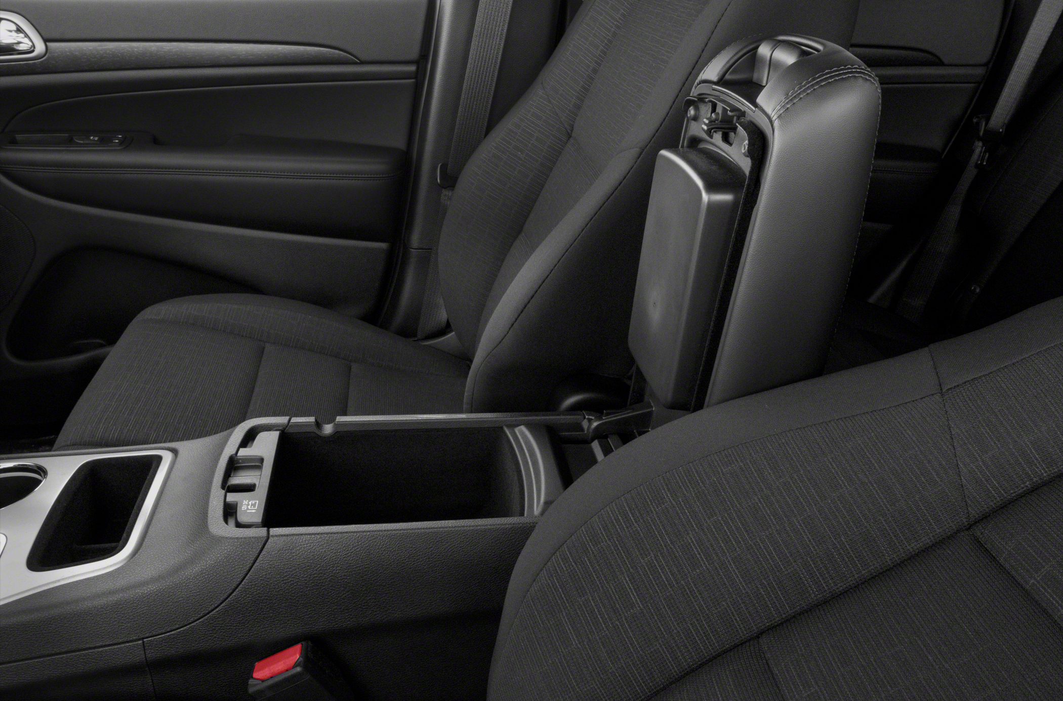Center armrest storage compartment with front seats upholstery