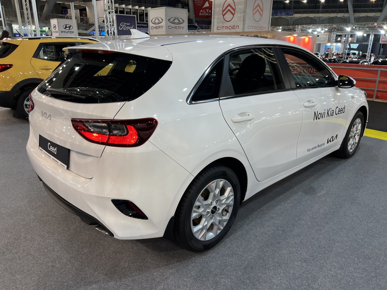 Rear and side view of hatchback with tail lights and alloy wheel