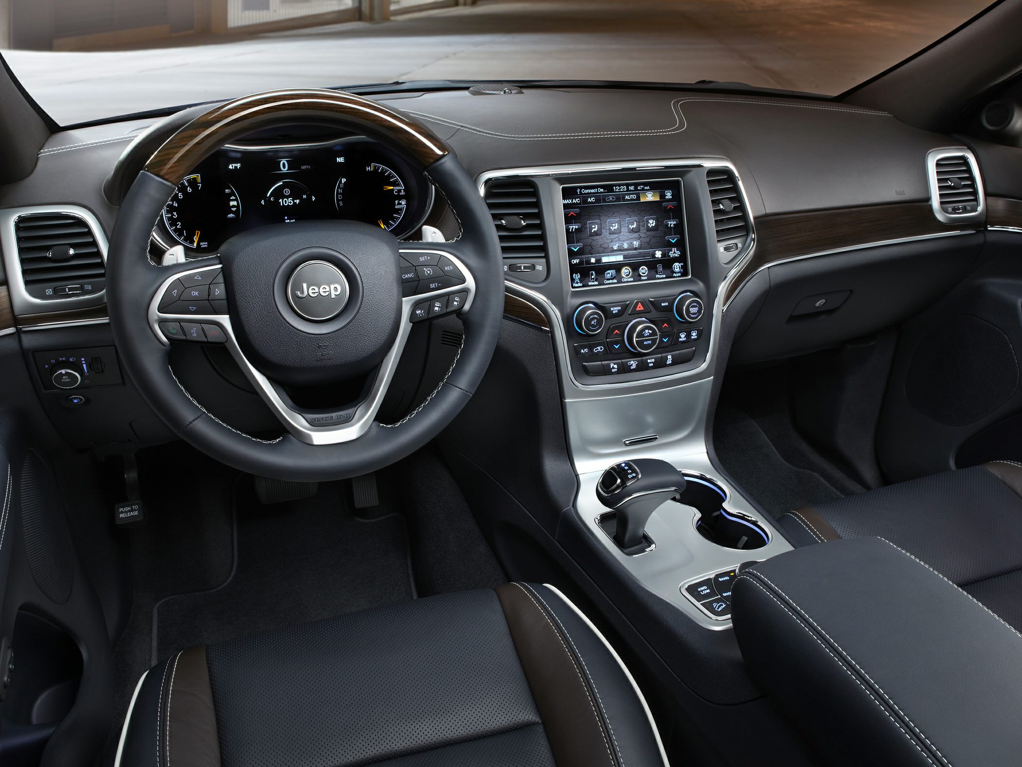 Steering wheel and dashboard with touchscreen and wood trim