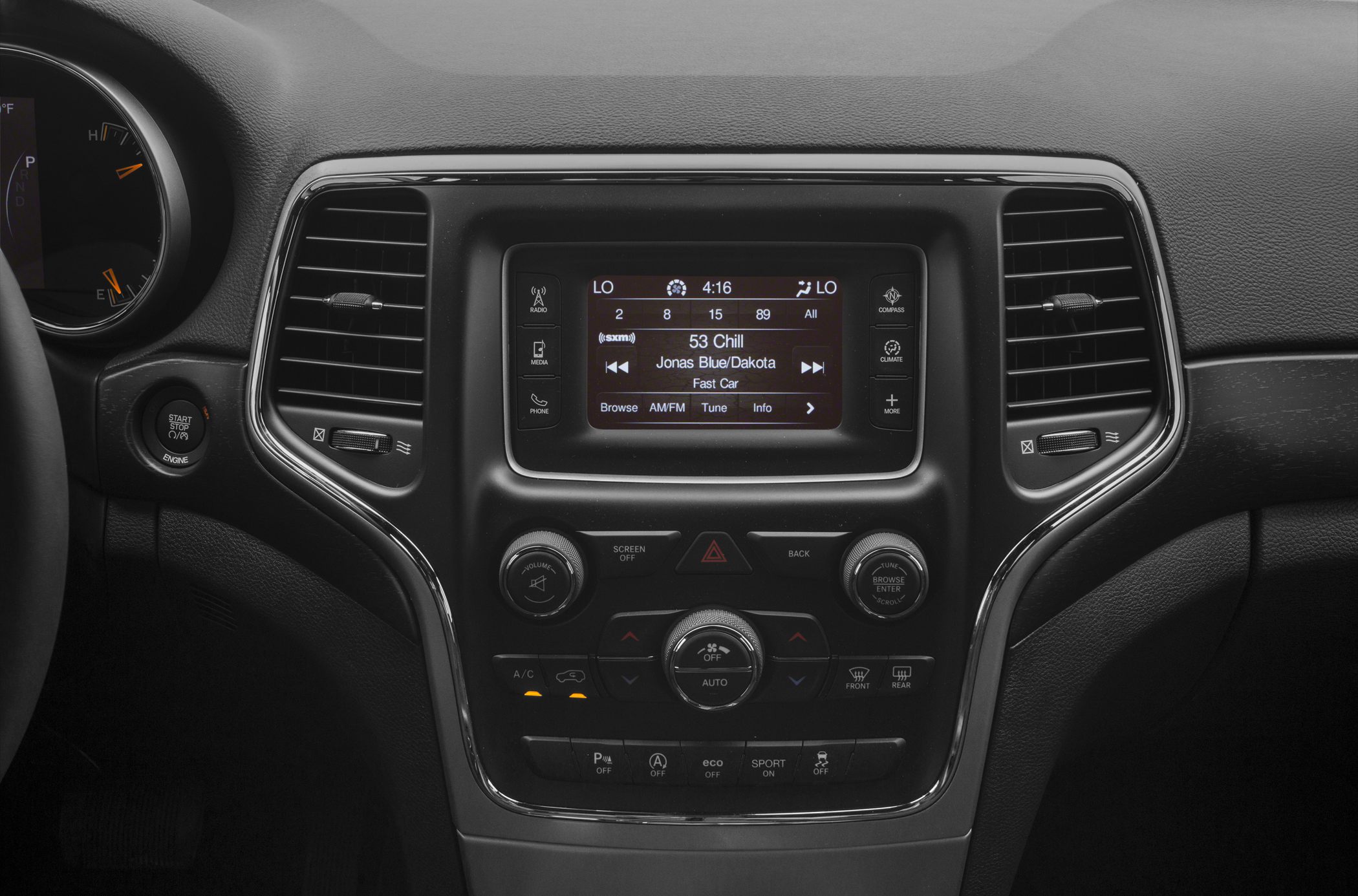 Dashboard console with touchscreen, climate controls, and multifunction buttons