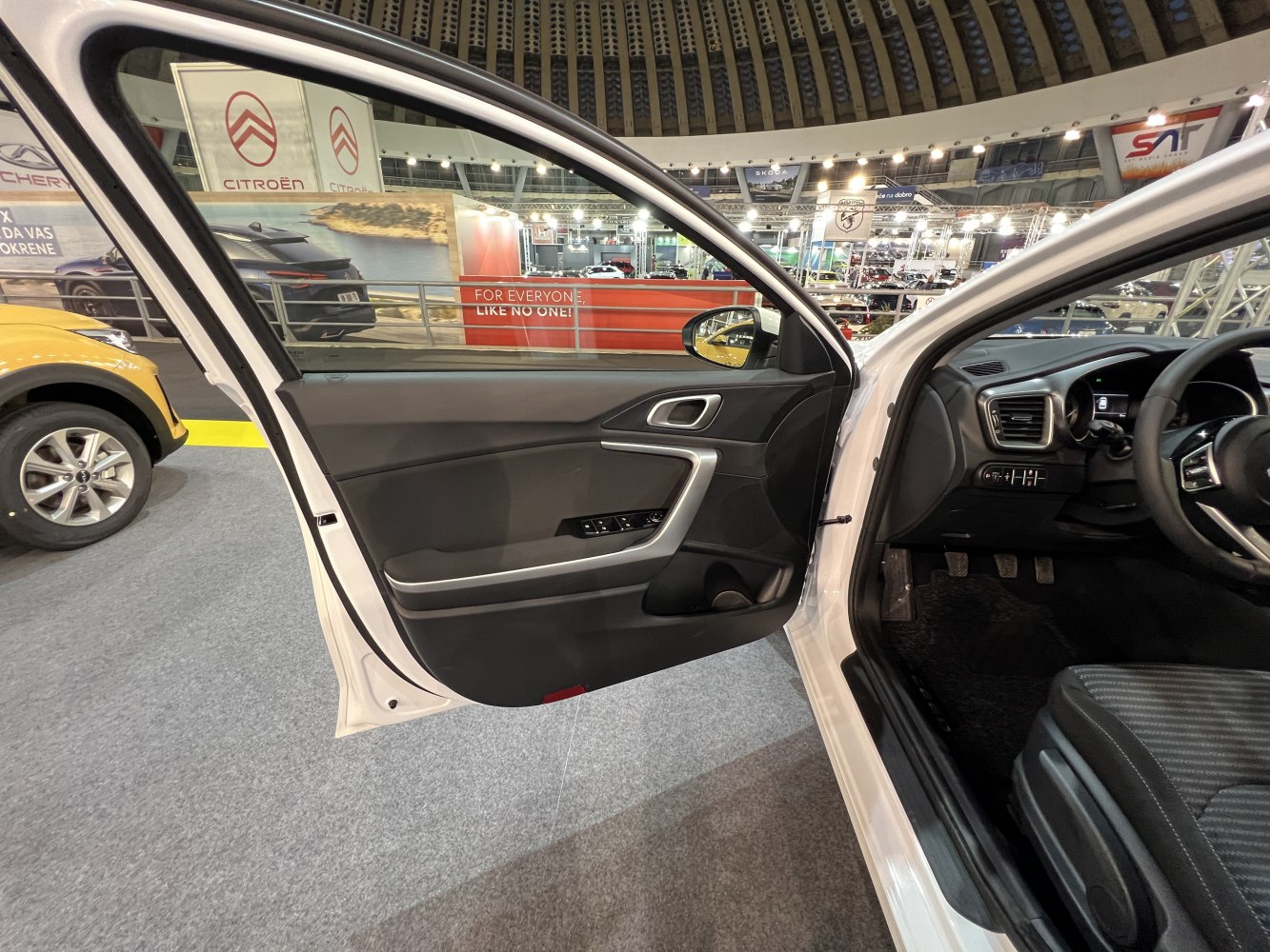 Front driver door interior panel with window and lock controls.