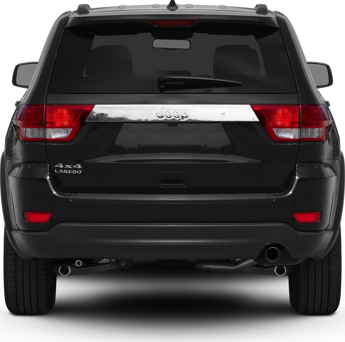 Rear view of SUV with taillights, rear window wiper, and dual exhaust