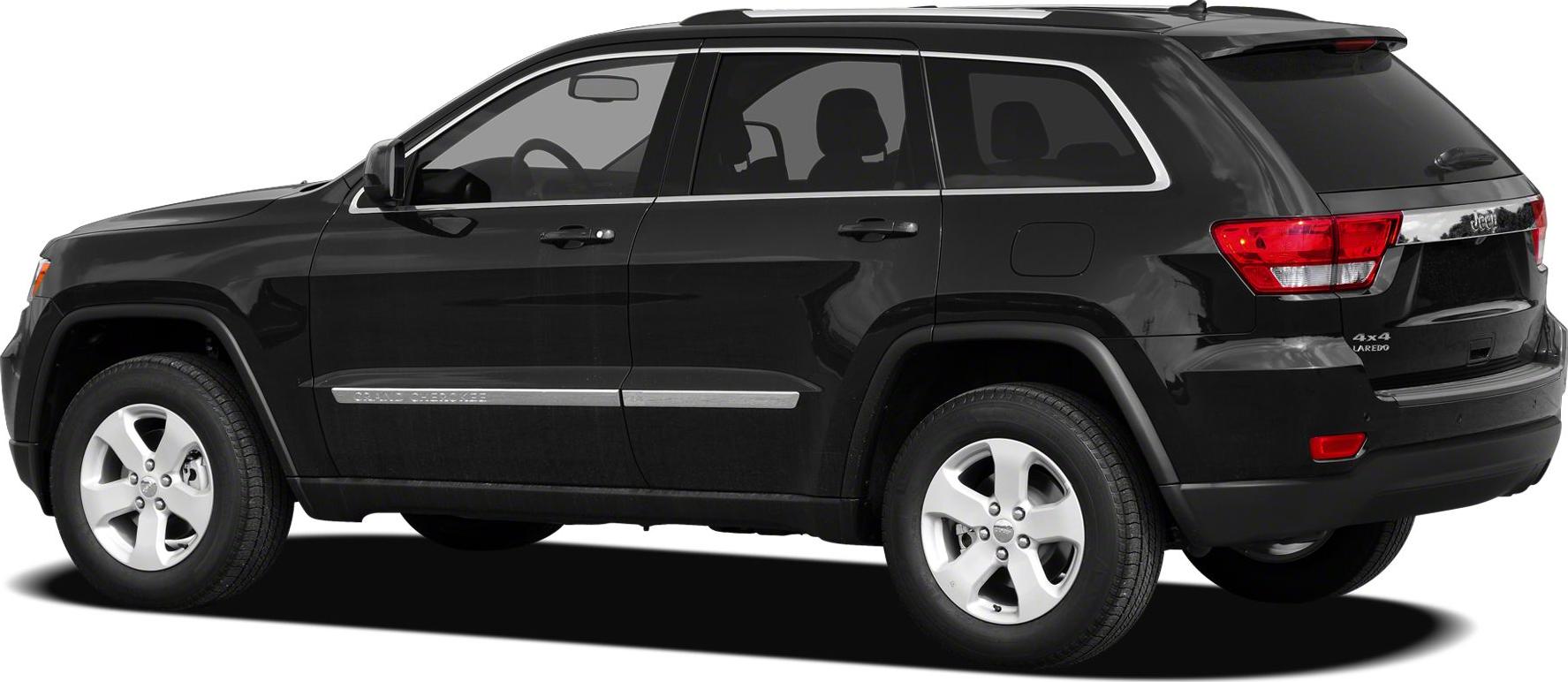 SUV side profile with alloy wheels, roof rails, and chrome trim
