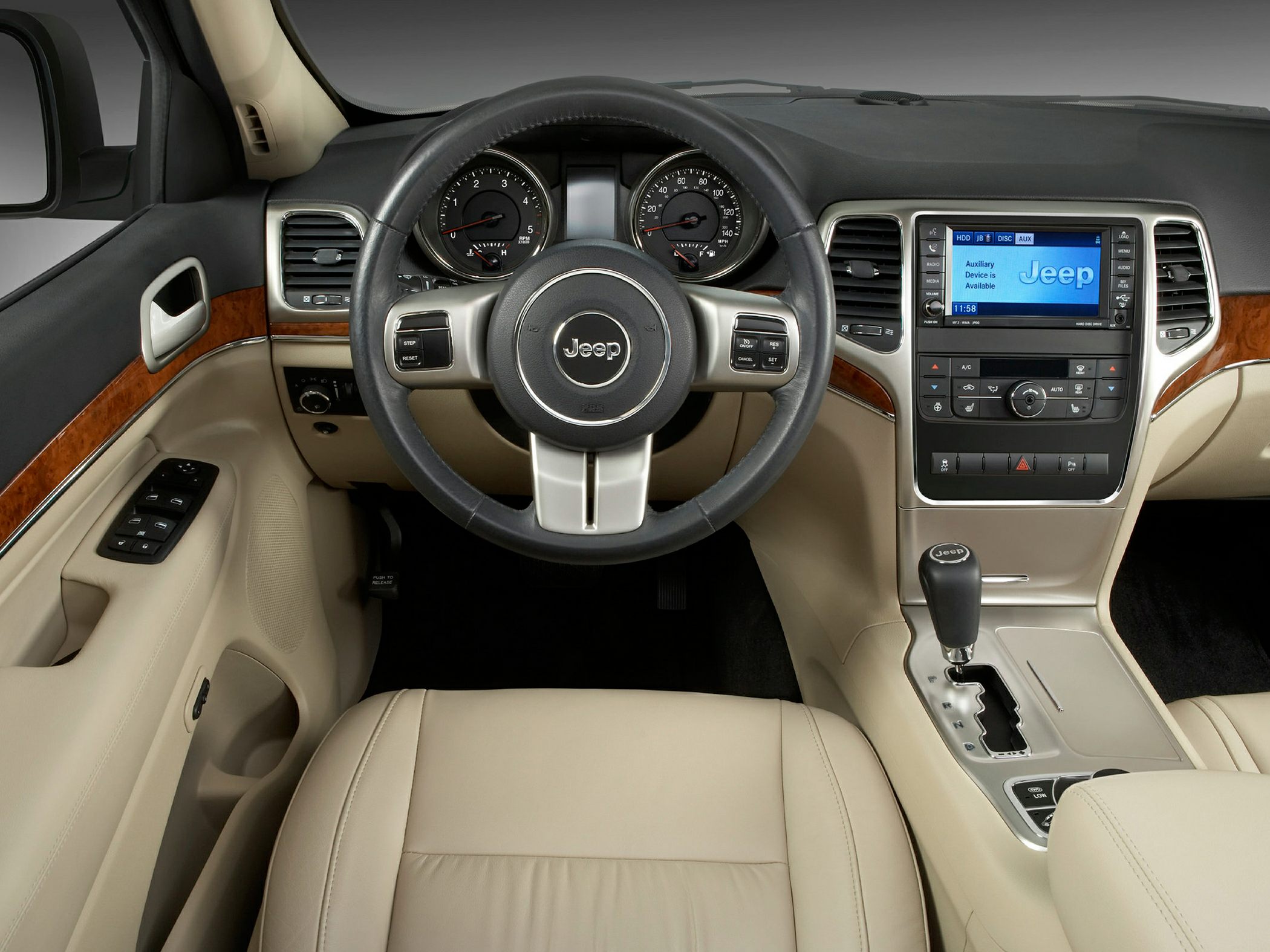 Modern SUV interior with steering wheel and dashboard controls