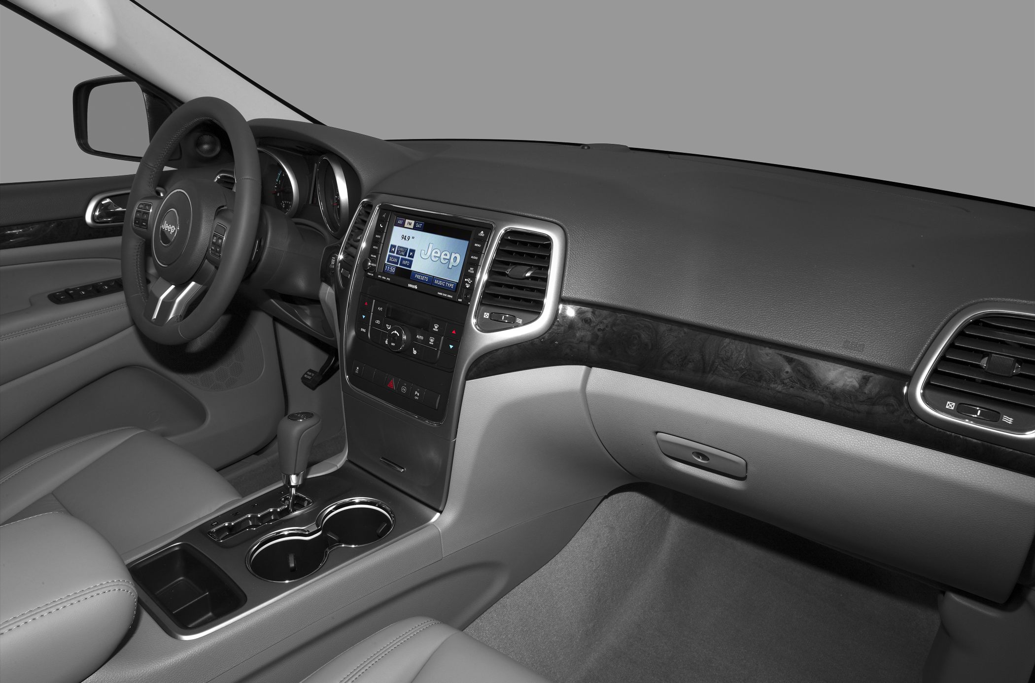 SUV interior featuring dashboard, steering wheel, and center console with infotainment system