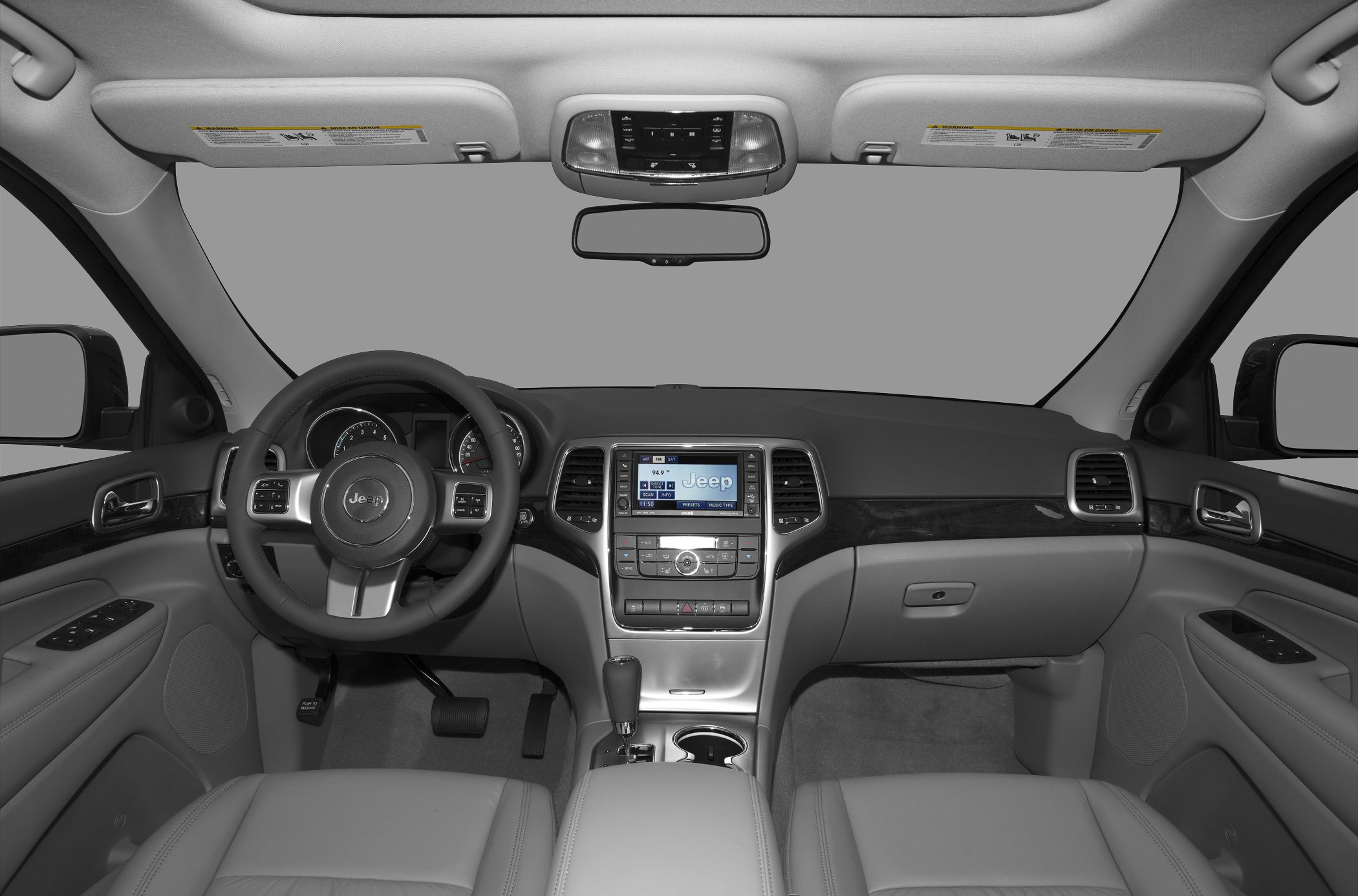 Dashboard and steering wheel with infotainment display