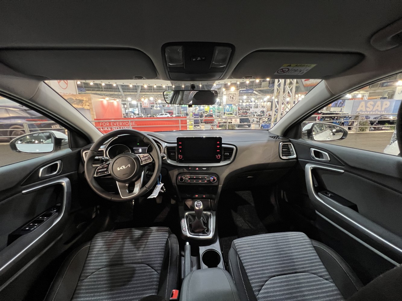 Modern car interior with touchscreen and manual gear shift