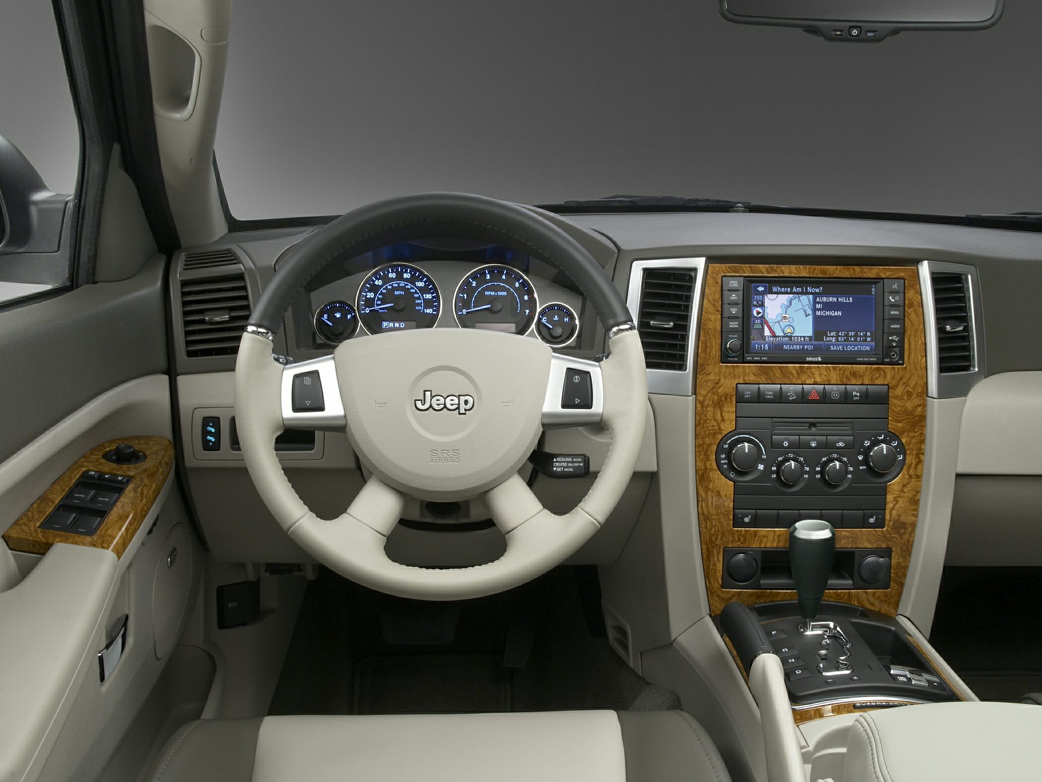 Dashboard, steering wheel, navigation, and wood trim center console