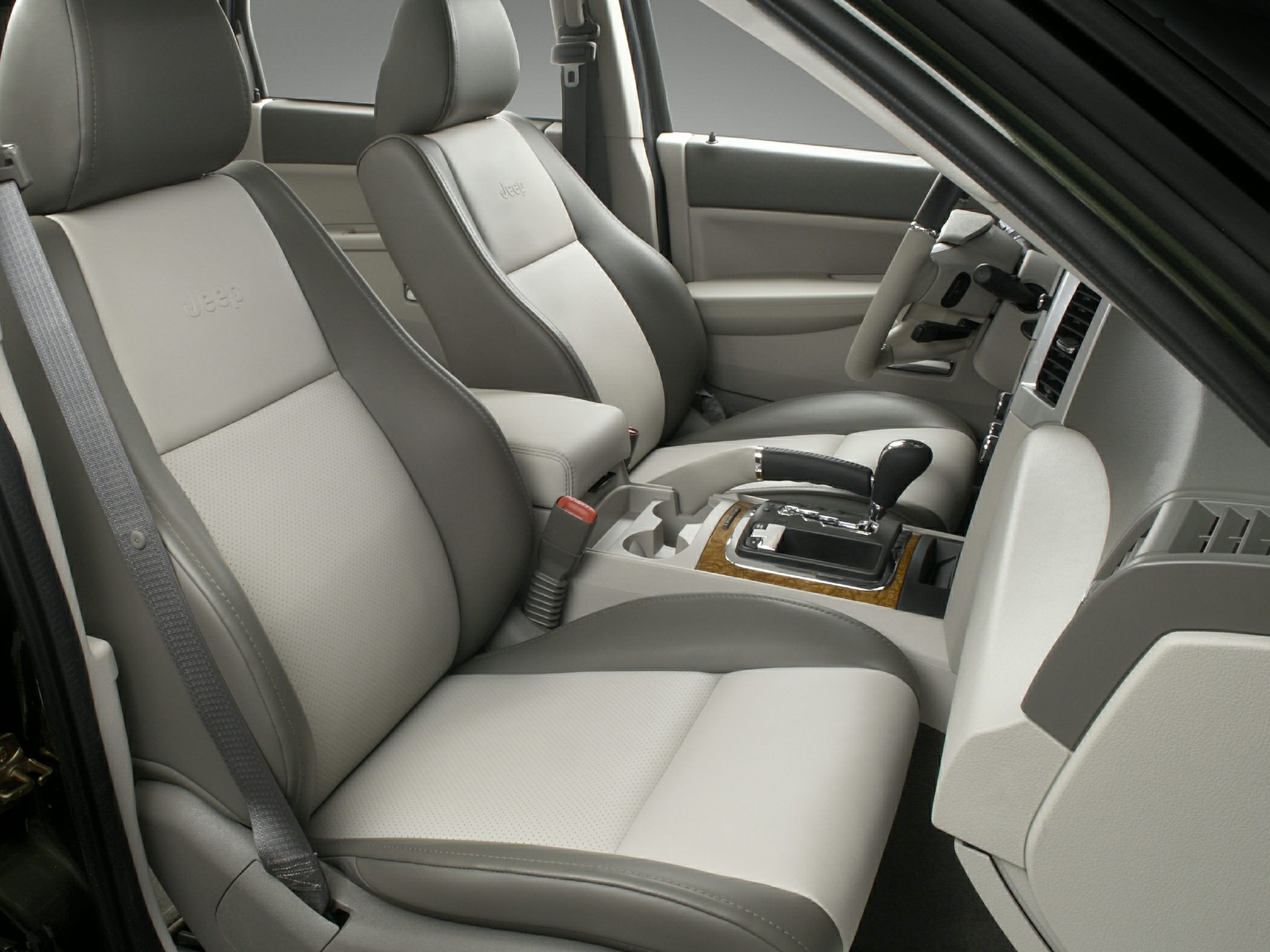 Leather seats and center console with gear shifter inside a vehicle