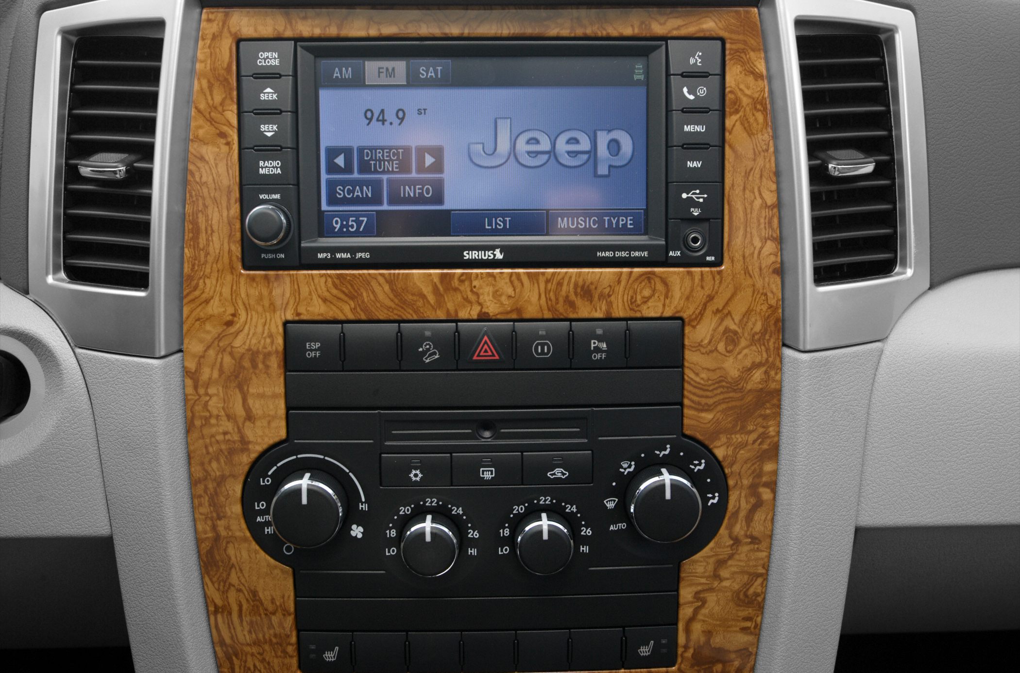 Infotainment system and climate control panel with wood trim