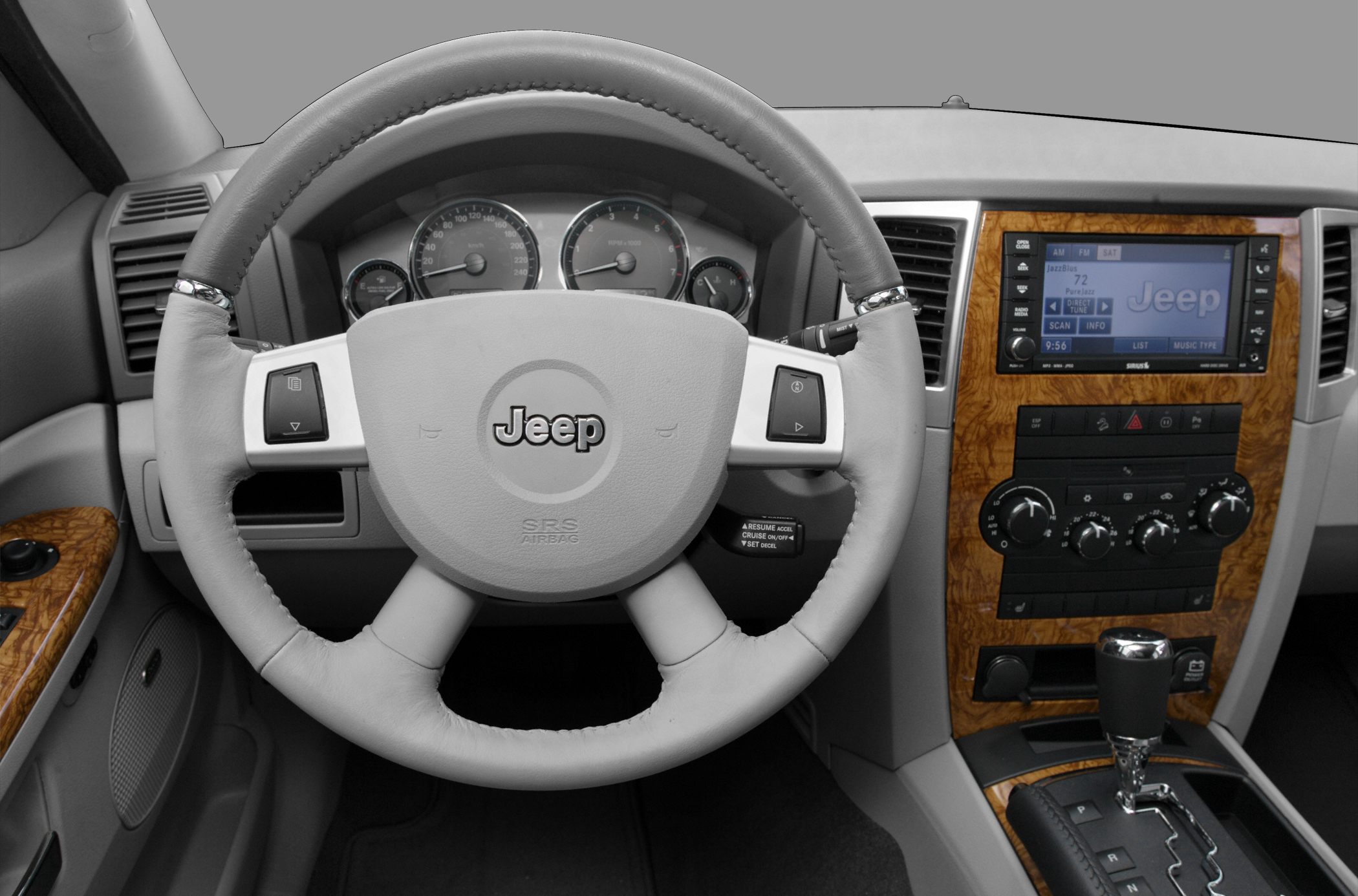 Steering wheel and wood trim dashboard with multimedia screen
