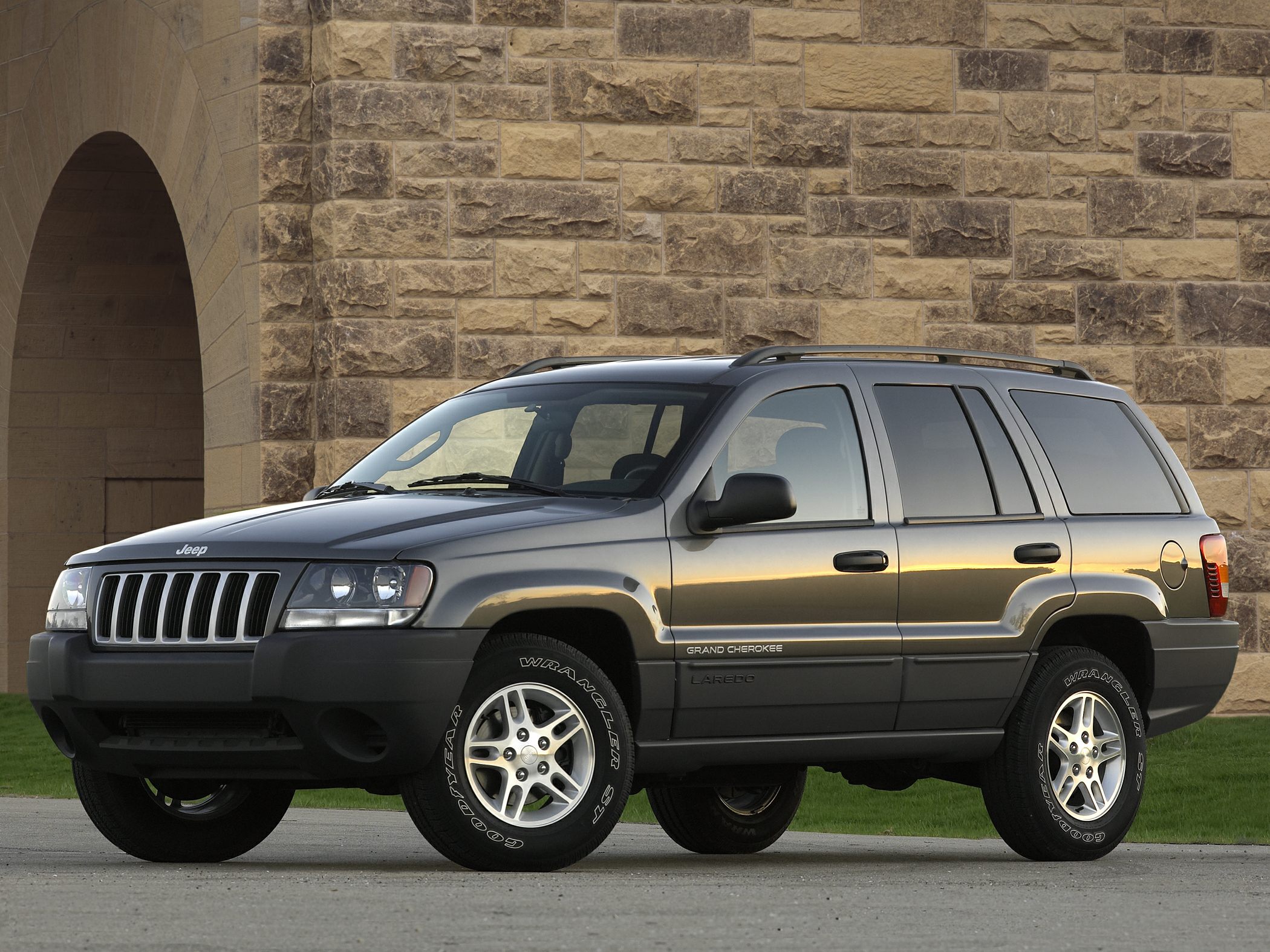 Boxy SUV with seven-slot grille and rugged design in side profile
