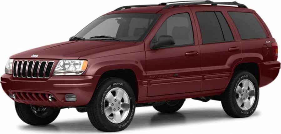 Maroon mid-size SUV with classic Jeep grille and 5-spoke alloy wheels