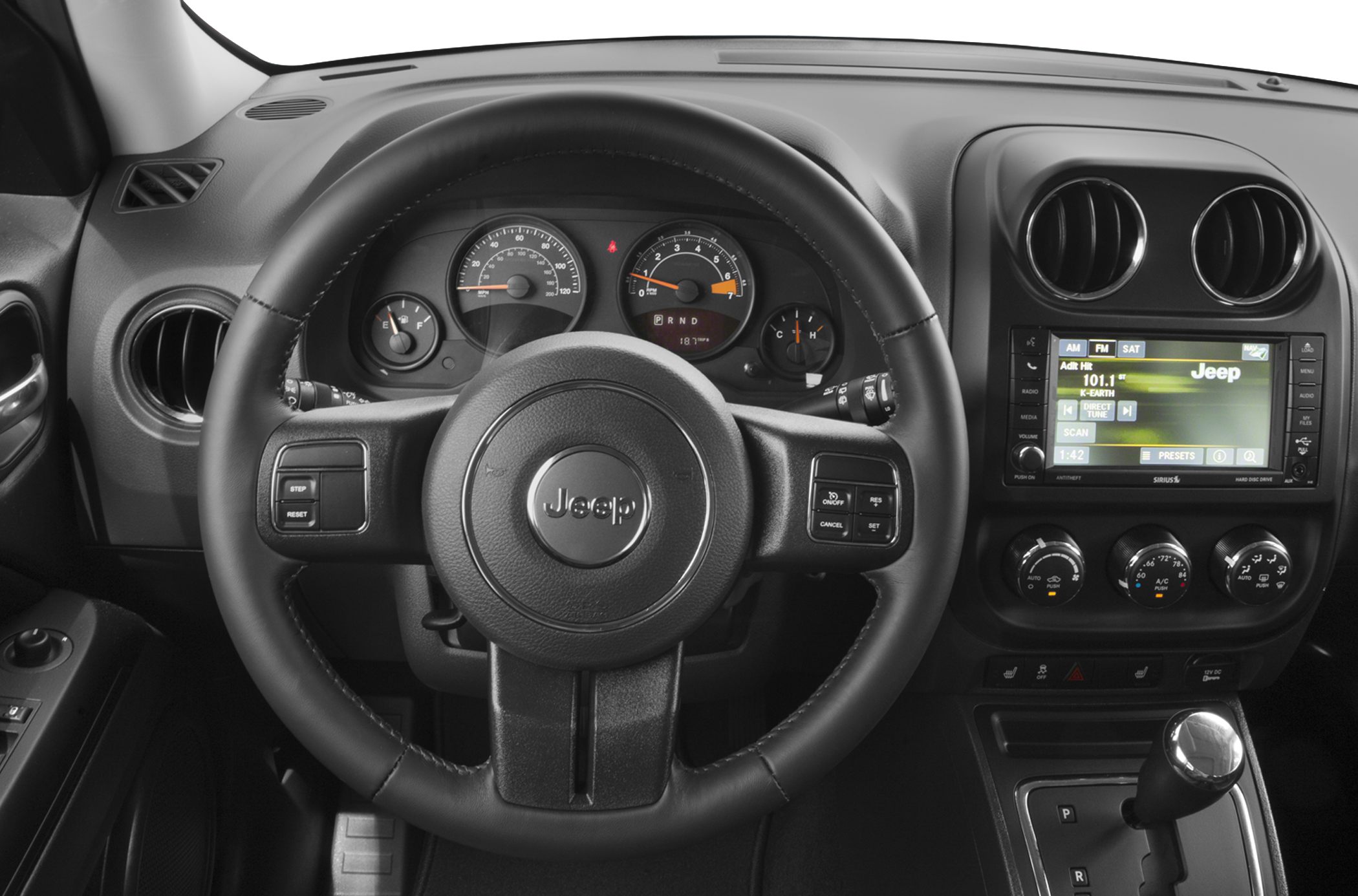 Steering wheel, speedometer cluster, infotainment screen, climate control dials