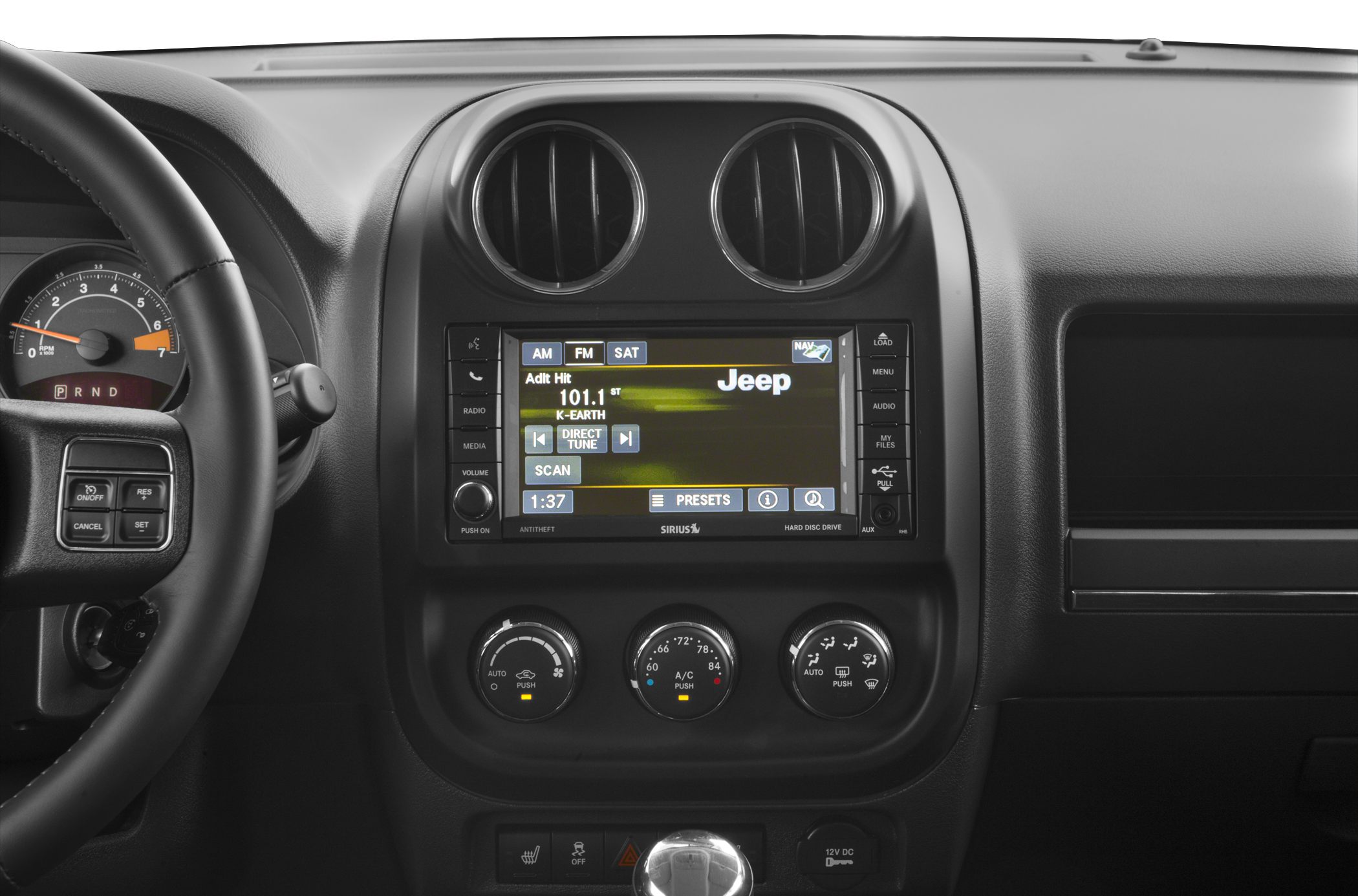 Dashboard with infotainment display, air vents, and climate control knobs
