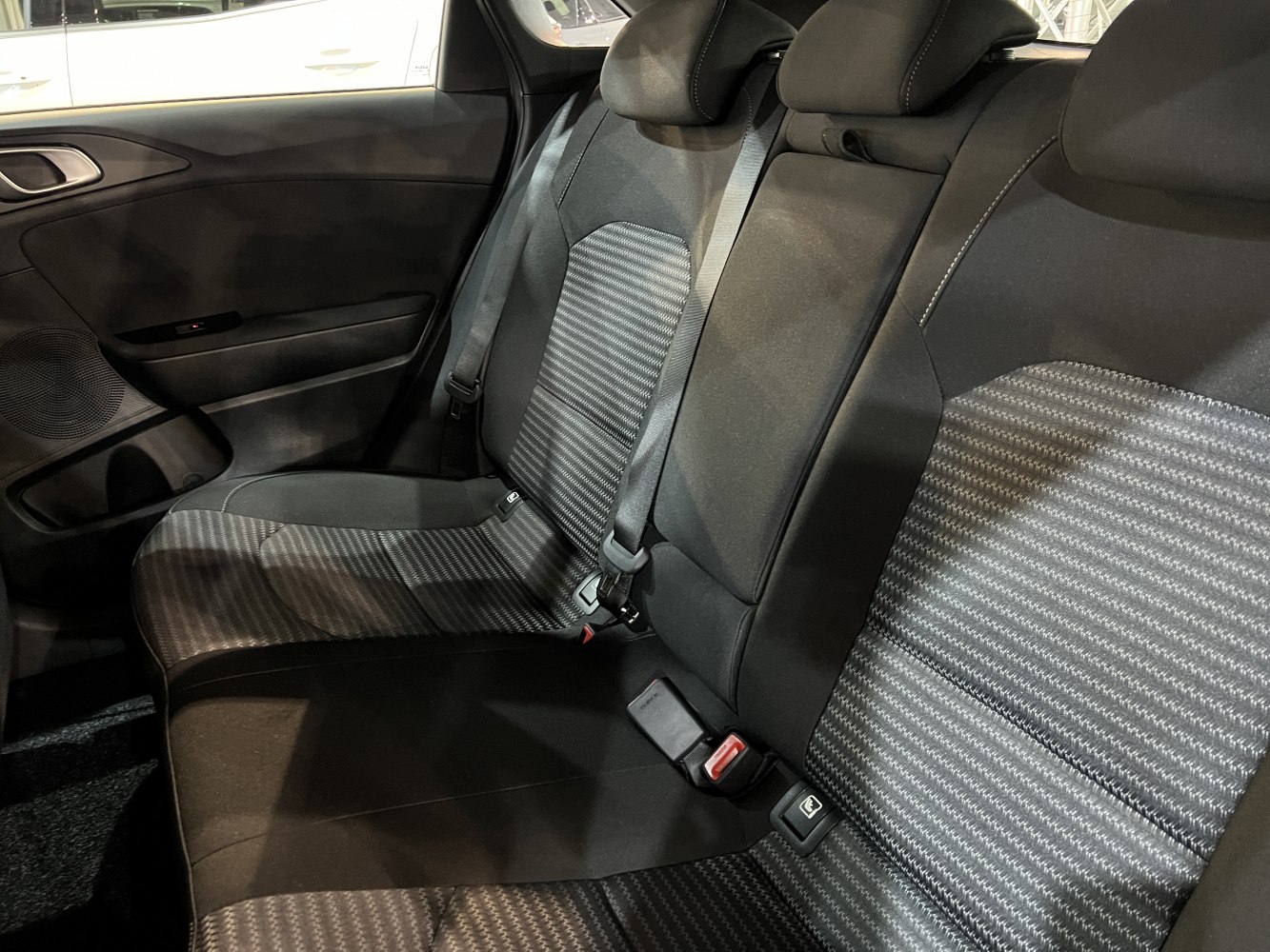Rear seat fabric upholstery with seatbelts and headrests