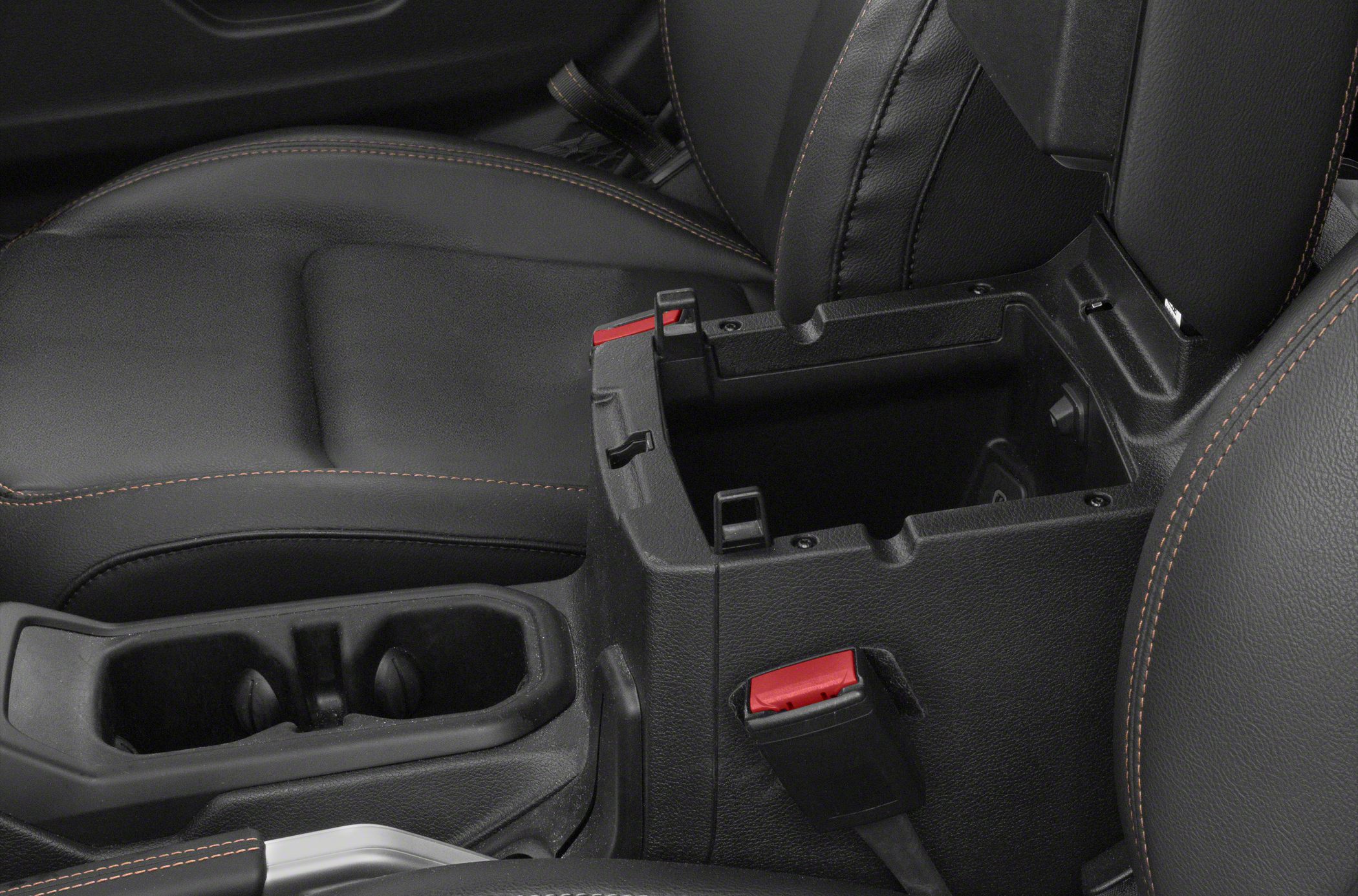 Center console storage compartment with cup holders and detailed seat stitching