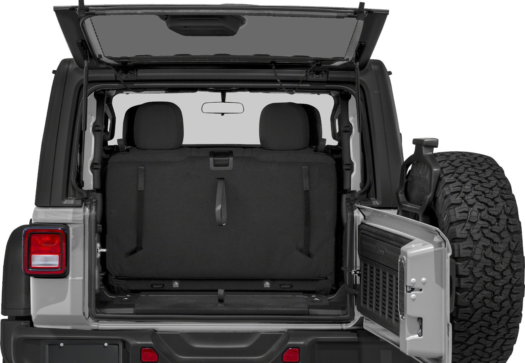 Open rear cargo area with back seats and mounted spare tire