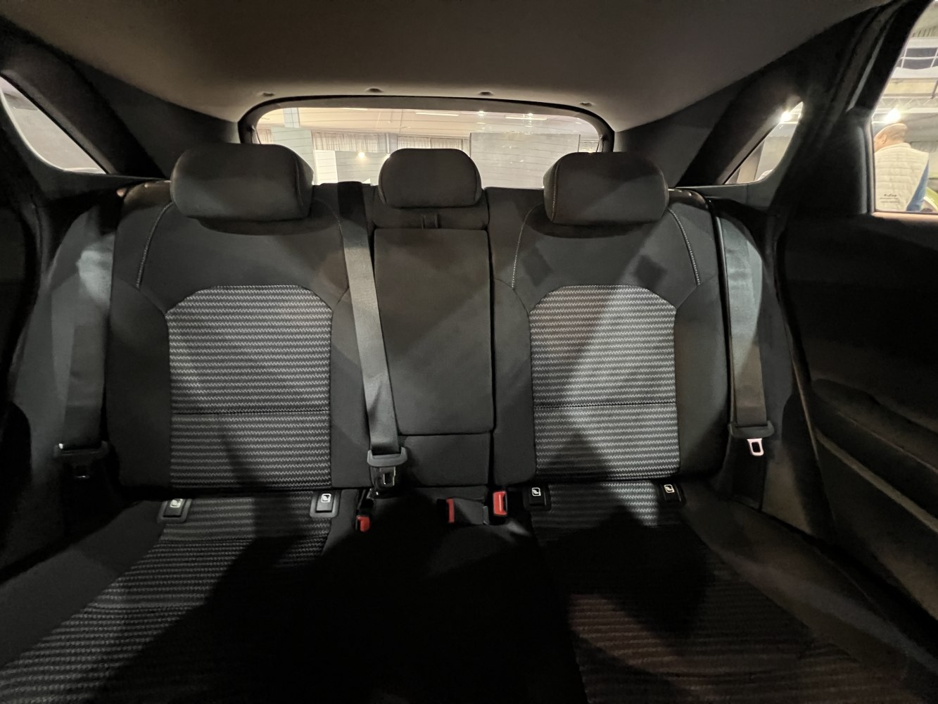 Modern rear seat upholstery with headrests and seat belts