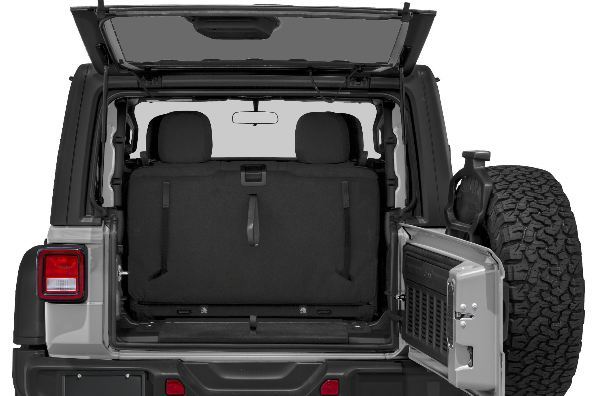 Open rear cargo area with rear door and spare tire mounted.