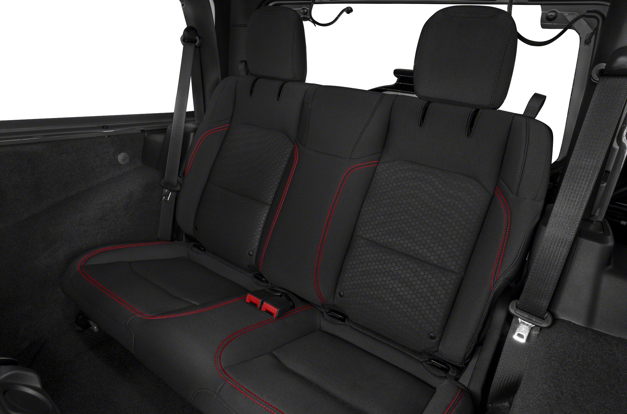 Black rear seat with red stitching and seat belts