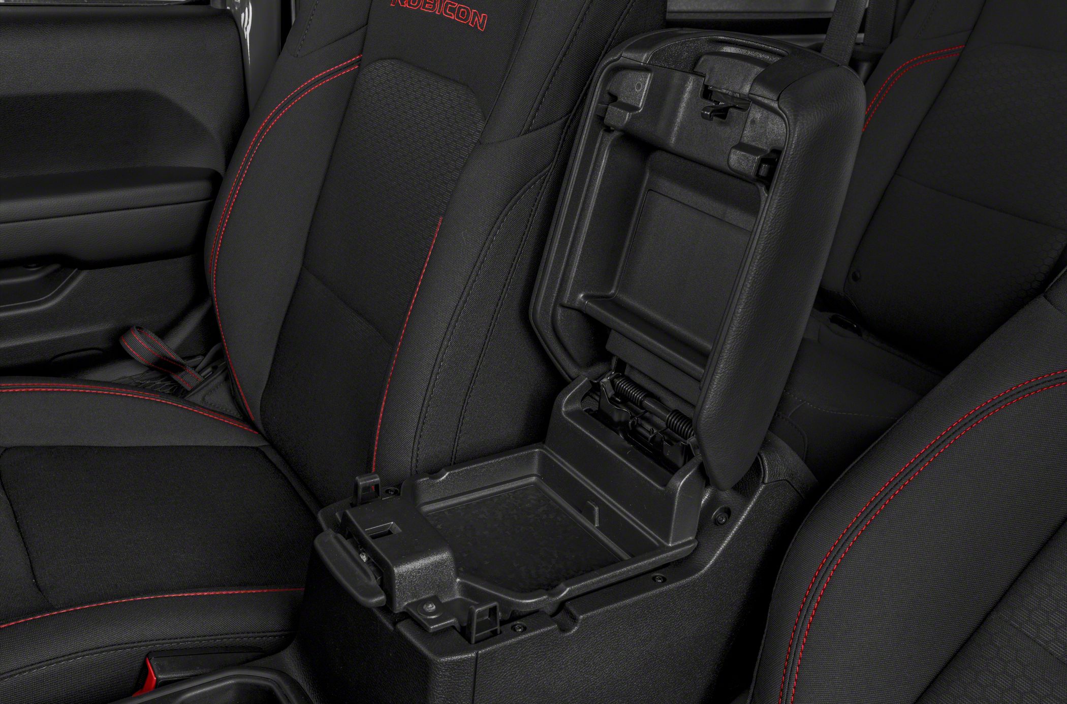 Interior center console storage with armrest and red stitching accents